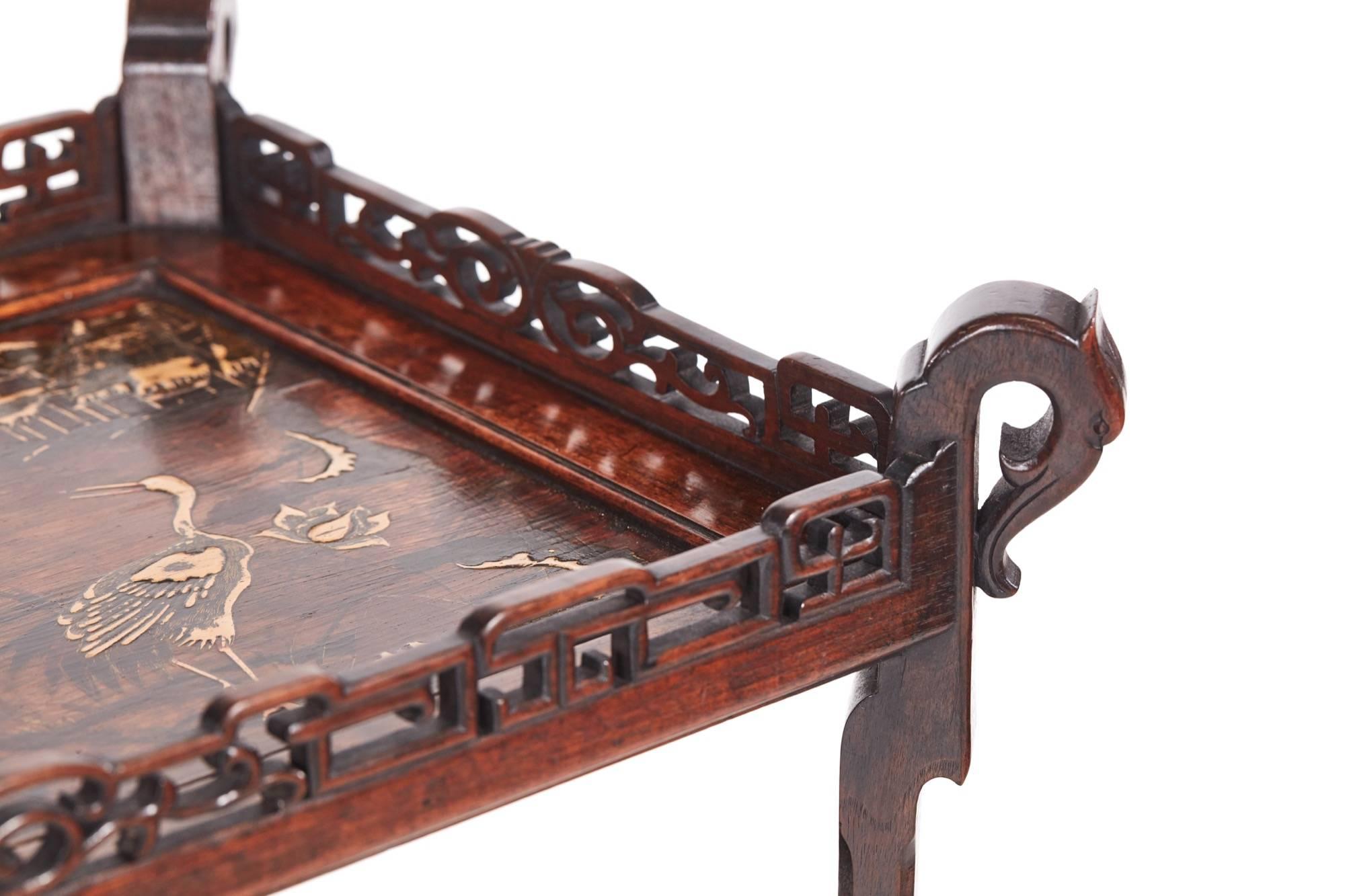 Unusual Meiji period oriental hardwood inlaid table / stand, with a lovely inlaid top and a pierced gallery, three hardwood under-tiers with pierced supports, standing on four shaped legs, original castors
Lovely color and condition
Measure: 27