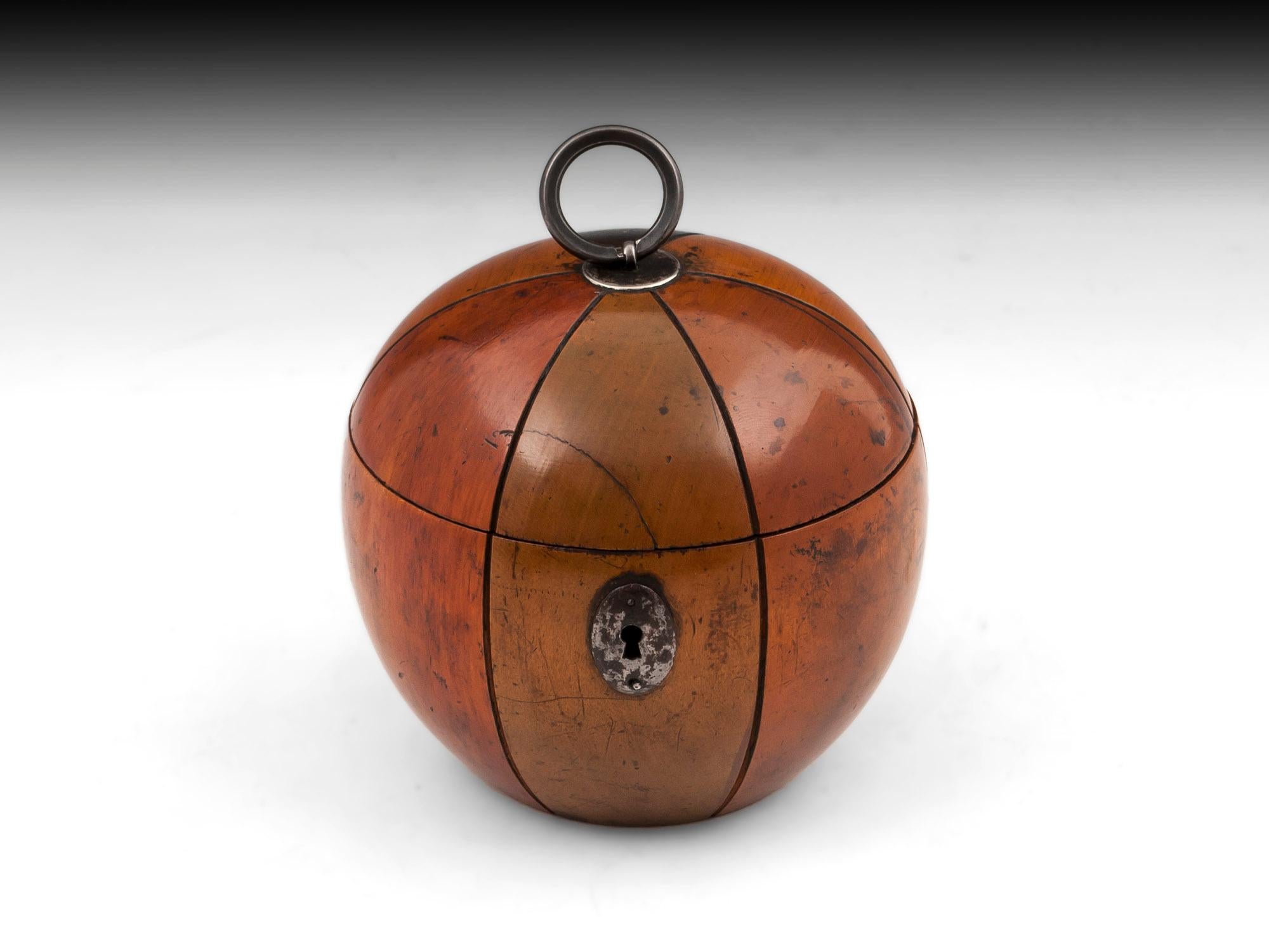 Unusual Melon shaped tea caddy with colored segments. With cut steel escutcheon, lock, hinge and ring handle. 

This rare fruit tea caddy comes with a fully working lock and tasselled key.