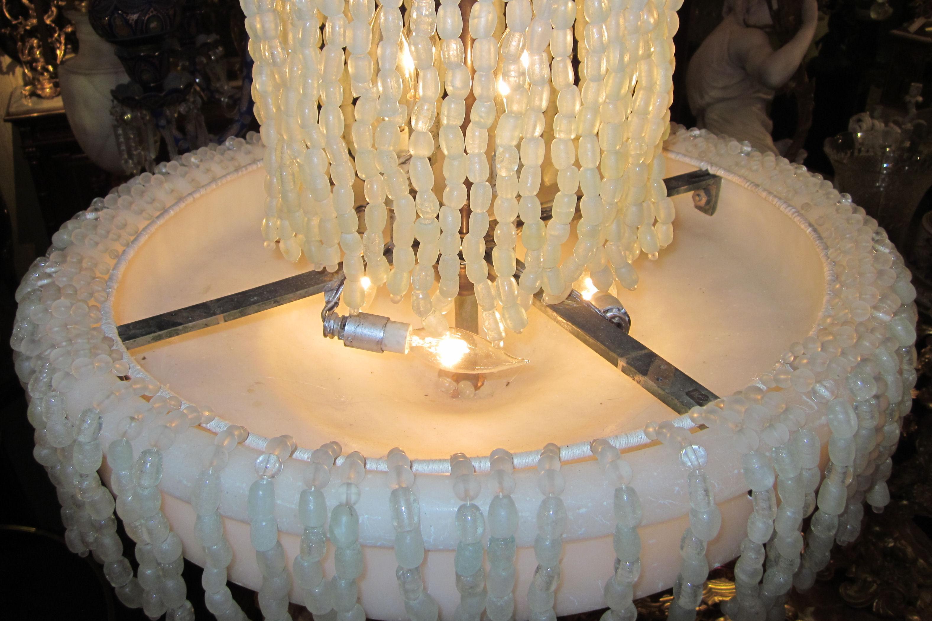 Unusual and finest quality French Art Deco alabaster and Rock crystal beaded cascade shape 11 lights chandelier in the manner of RUHLMAN or RATEAU.
Stock number: L361.