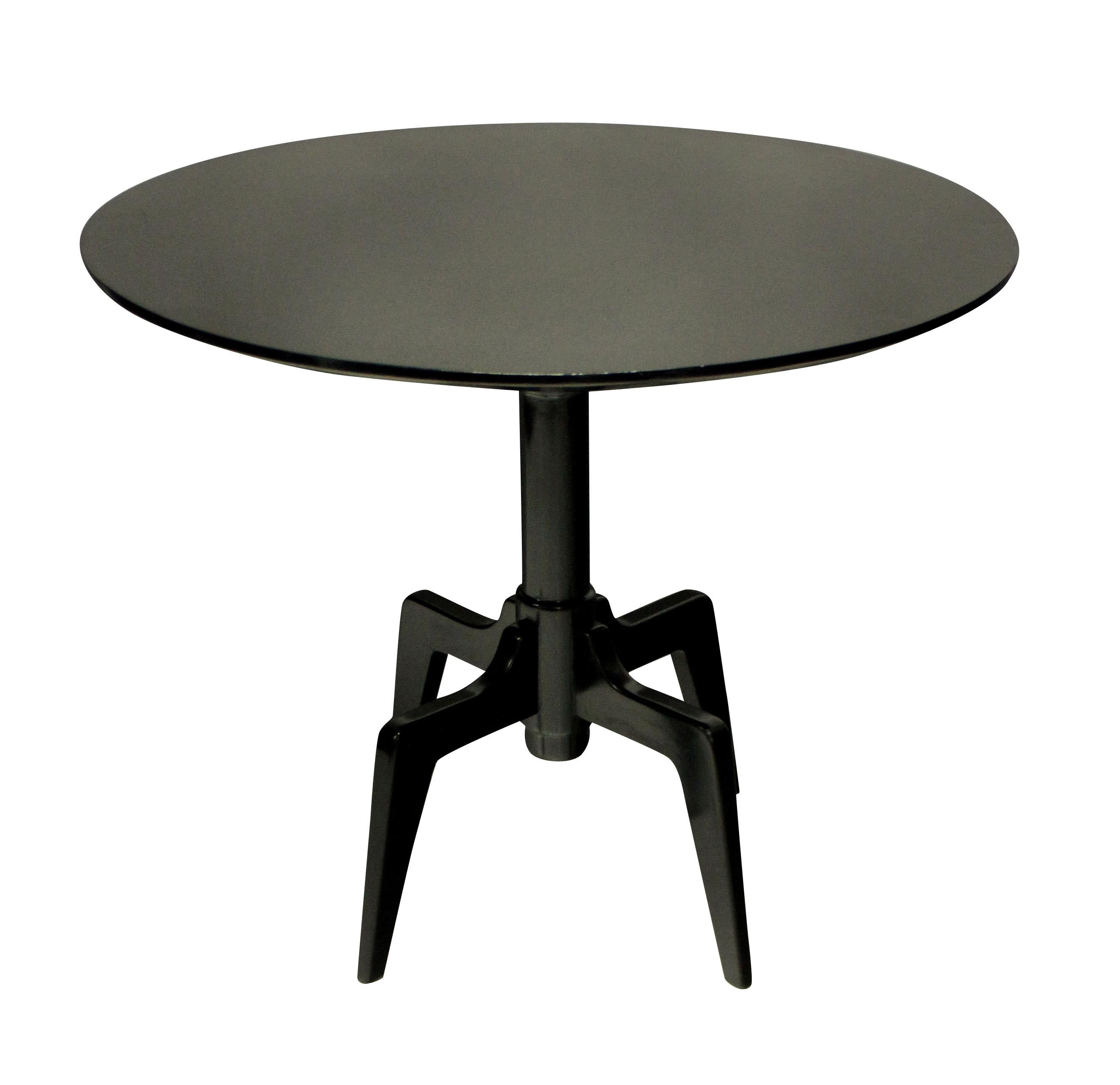 An unusual Italian midcentury, ebonized cherrywood centre table on raised articulated legs.
