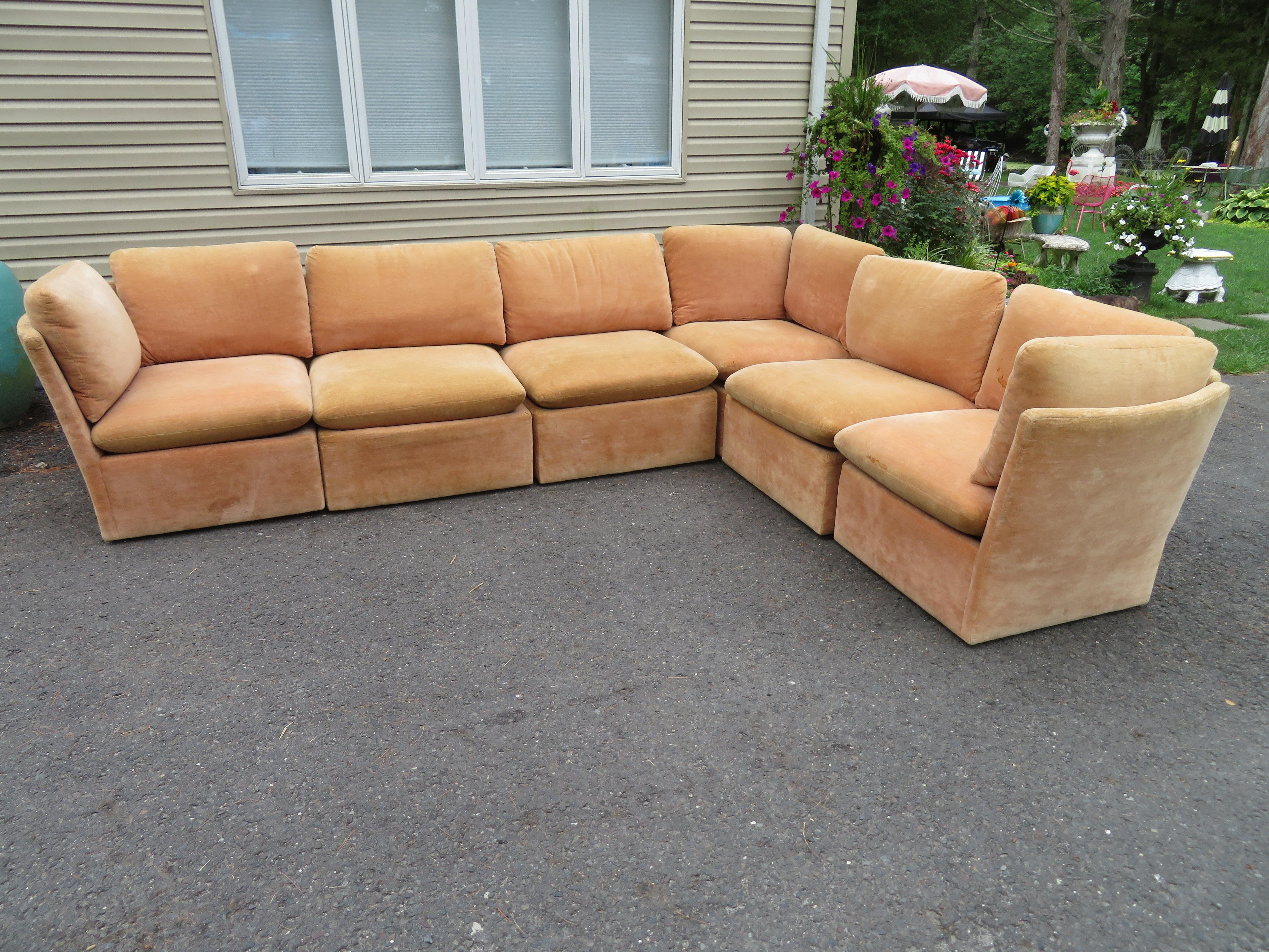 Unusual curved back 6-piece cube sectional sofa by Milo Baughman. We have had many many cube sofas by Mr Baughman but we have never seen this design with the curved back and the open arm detail. The original upholstery is worn and will need to be