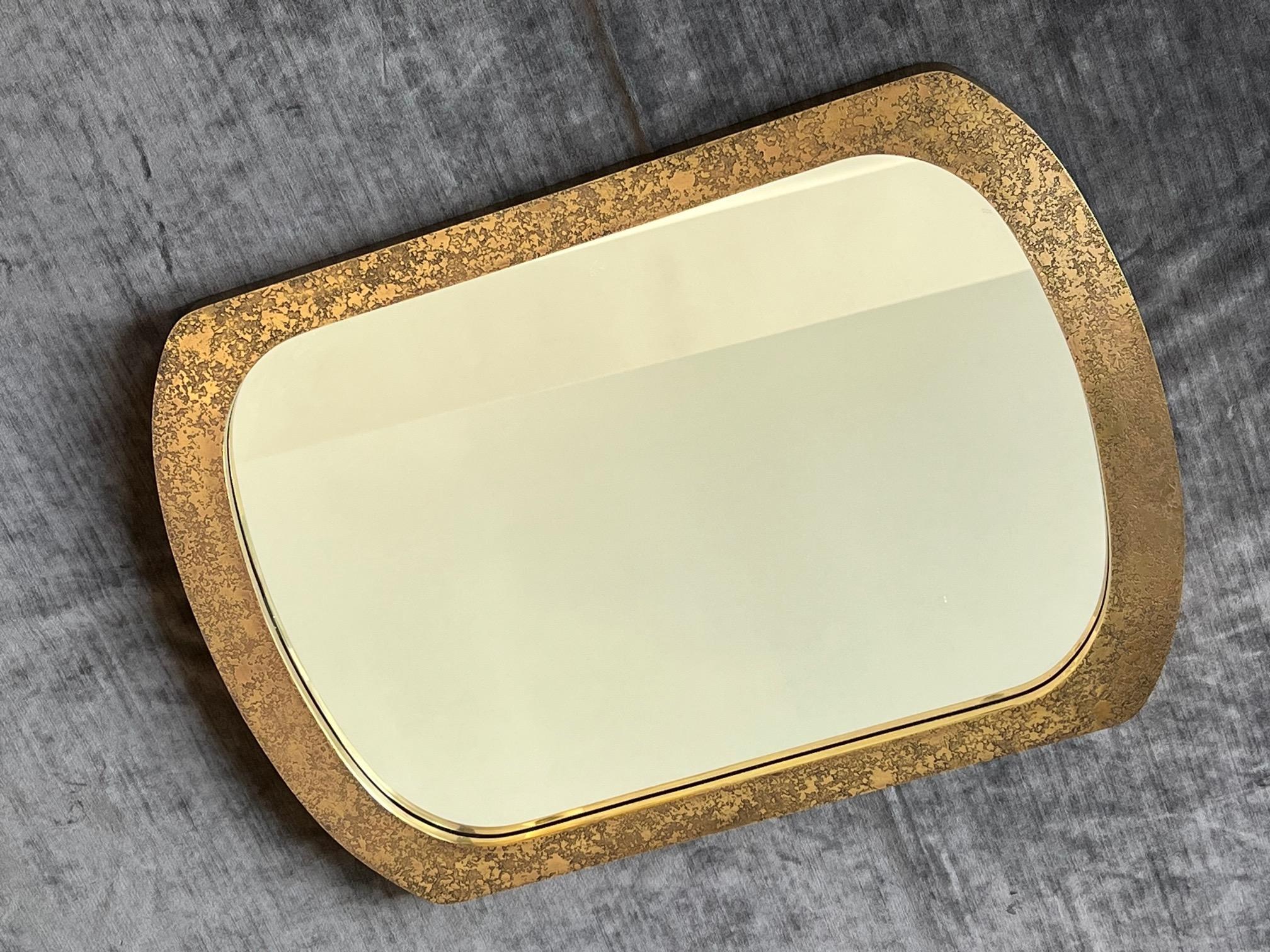 An unusual brass etched mirror, circa 1960s.