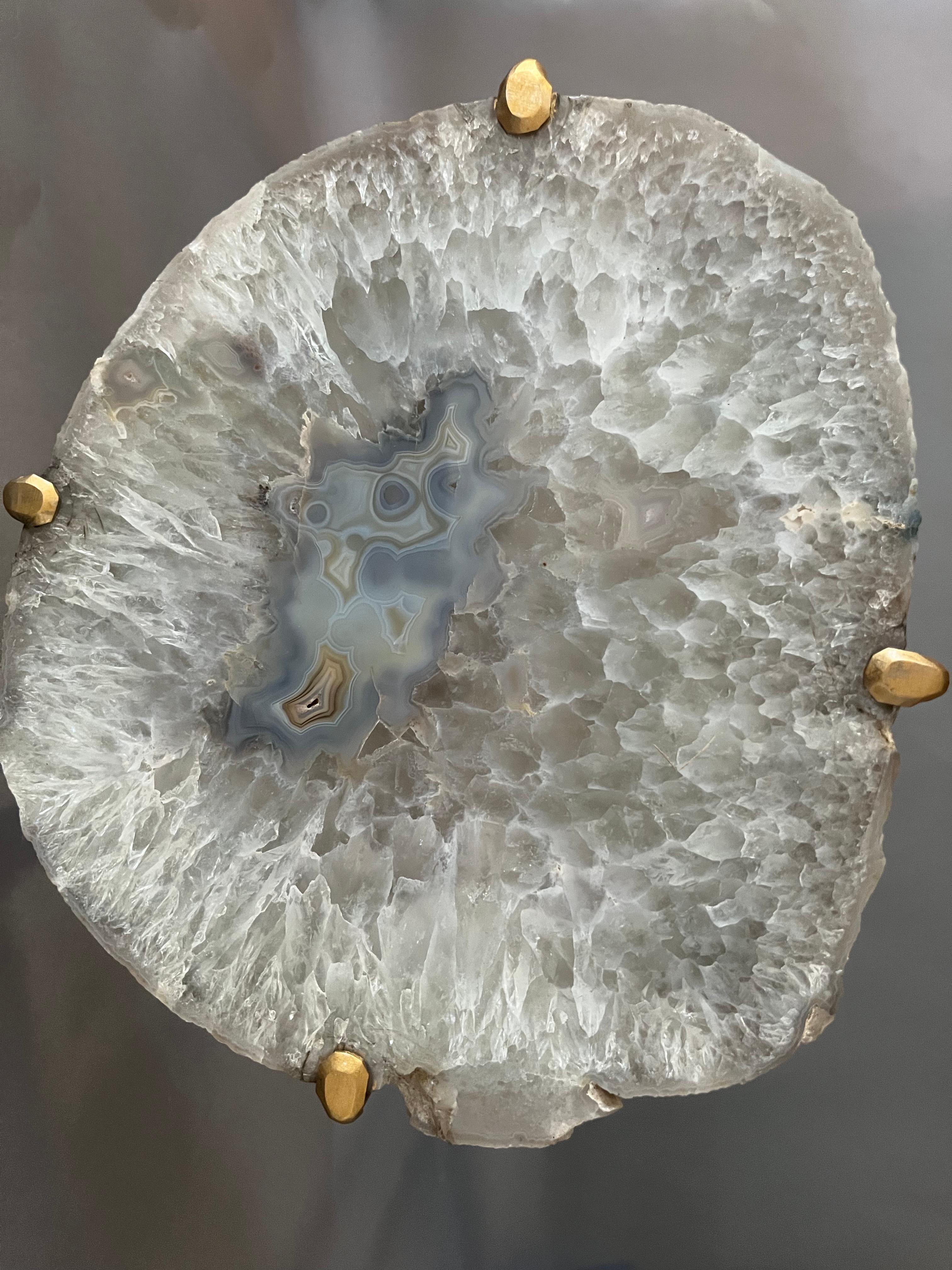 Our gorgeous geode drink tables are a perfect addition to any room, particularly in an area where the light catches them just right. Handcrafted with one of a kind quartzite slabs and gold gilt metal, this table is available as pictured or can be
