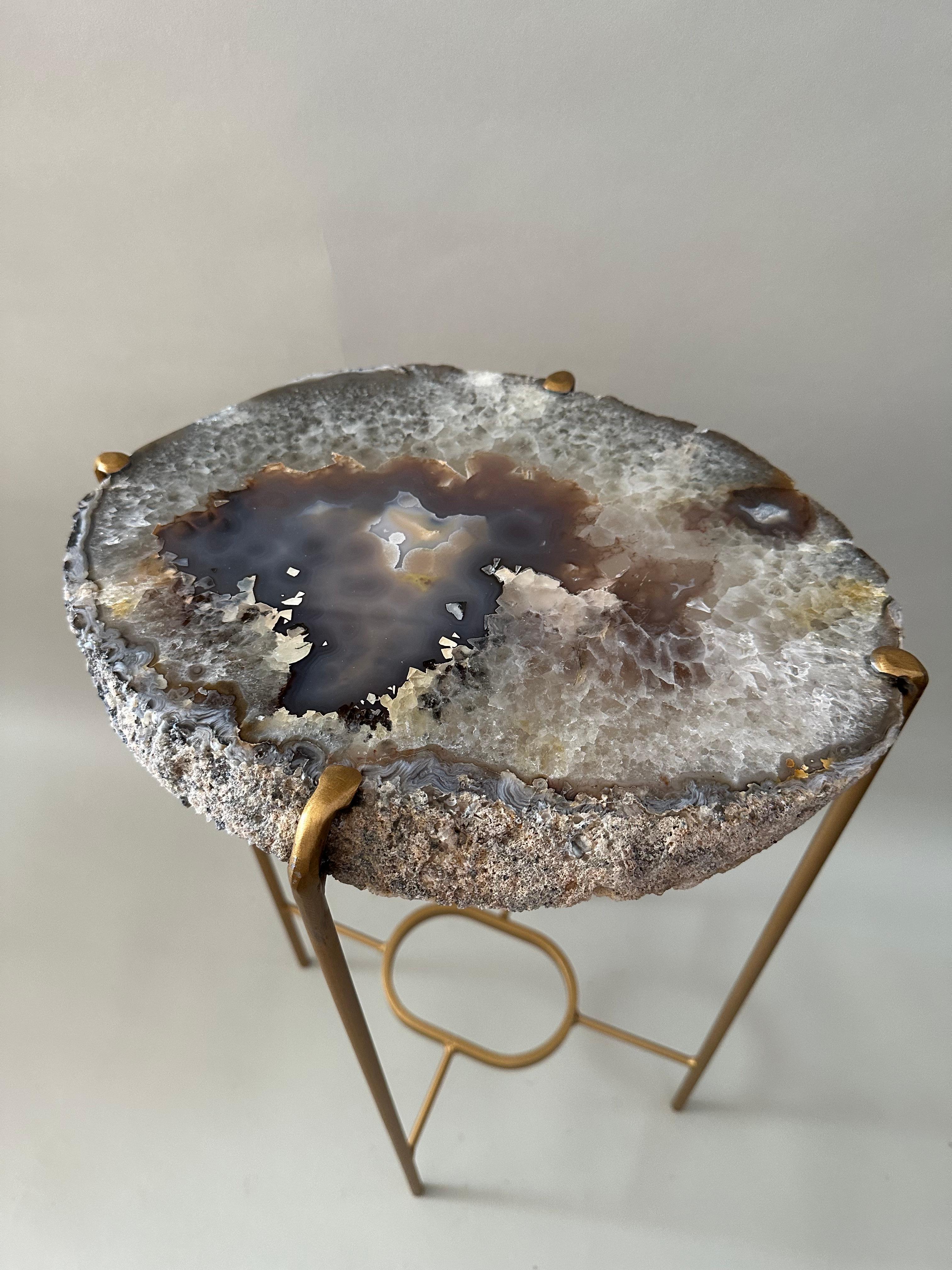 Unusual Modern Handcrafted Geode Drinks Table. Quartzite top with gilt steel base Mottled tans, grays purple crystal with deep blue and purple center