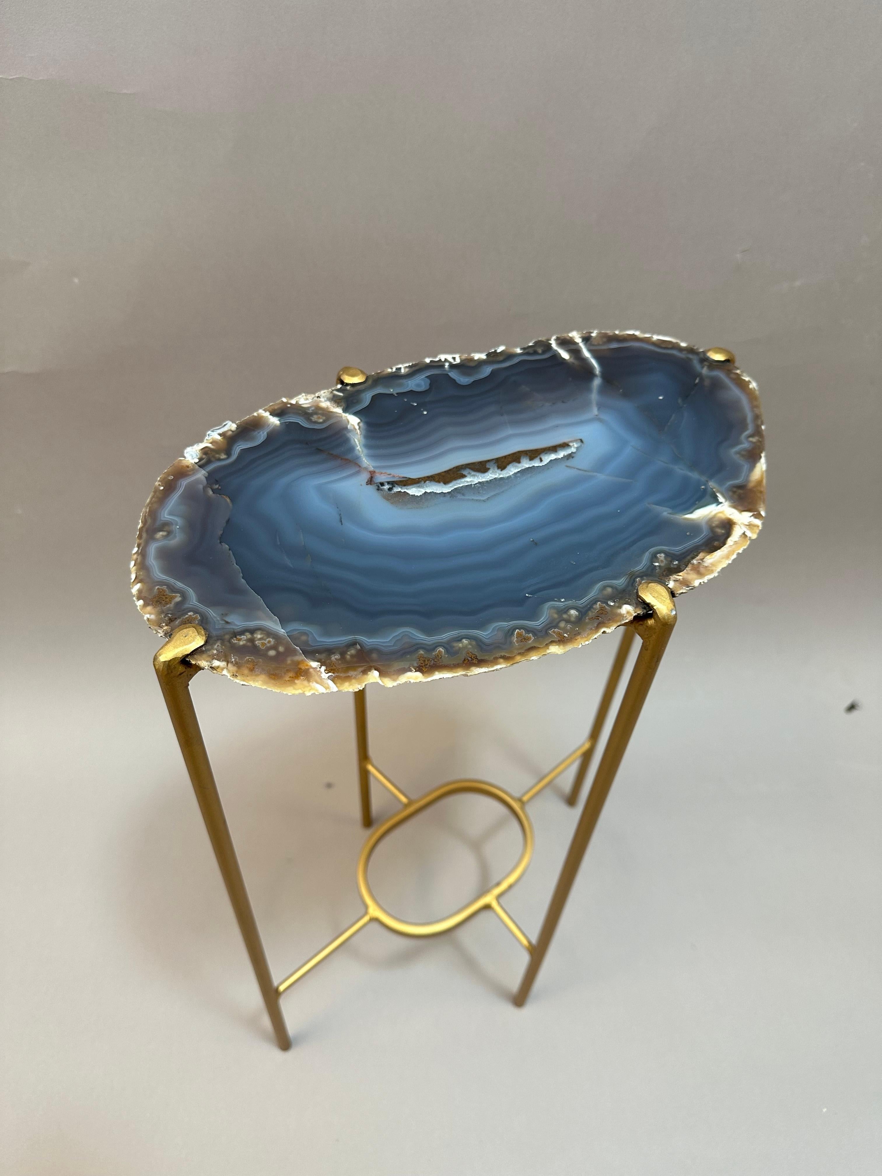 Unusual Modern Handcrafted Geode Drinks Table. Large quartzite top with a golden gilt steel base. Beautiful Dark Blue crystal with a multi blue center.
