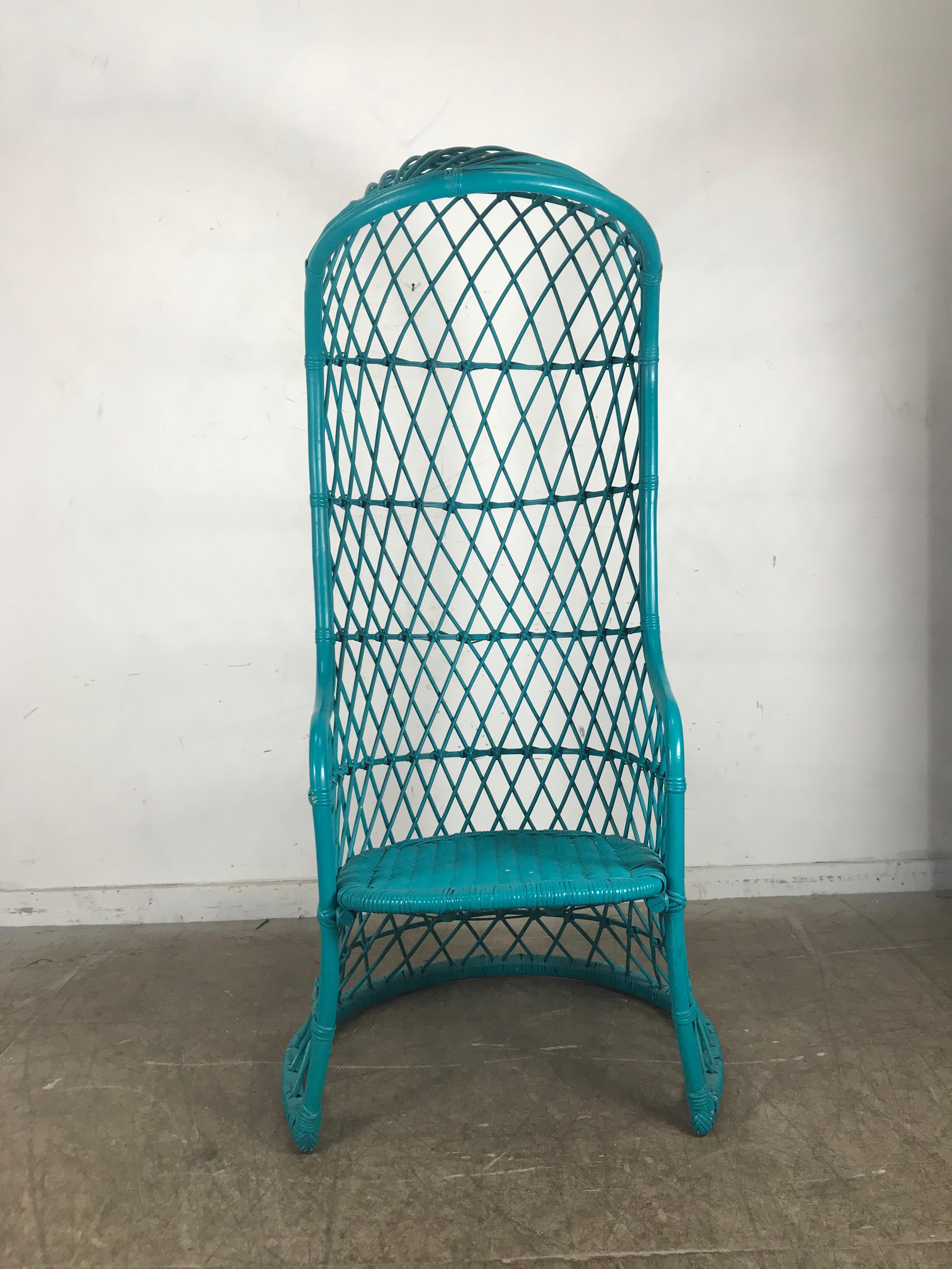 Unusual modernist hooded canopy wicker chair painted electric turquoise blue. Structurally sound. Comfortable great accent piece. Exterior garden or interior. Hand delivery avail to New York City or anywhere en route from Buffalo NY.
