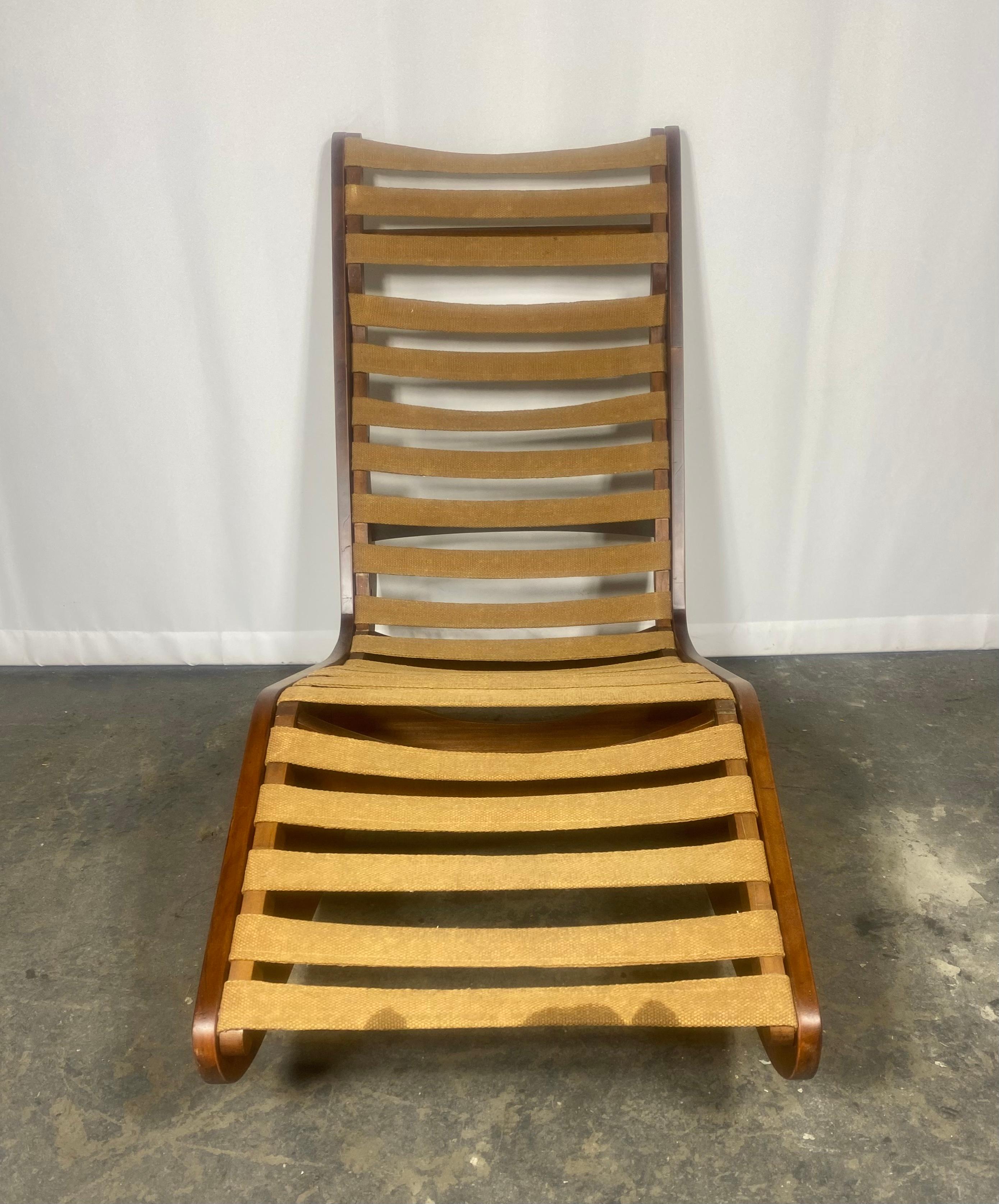 Unusual Modernist interior/ exterior rocking chaise lounge, atrb. to Klaus Grabe, Wood frame recently refinished.. retains original strapping,, aMAZING DESIGN, Extremely comfortable, Perfect piece for garden, porch, deck, patio, reading nook. Hand