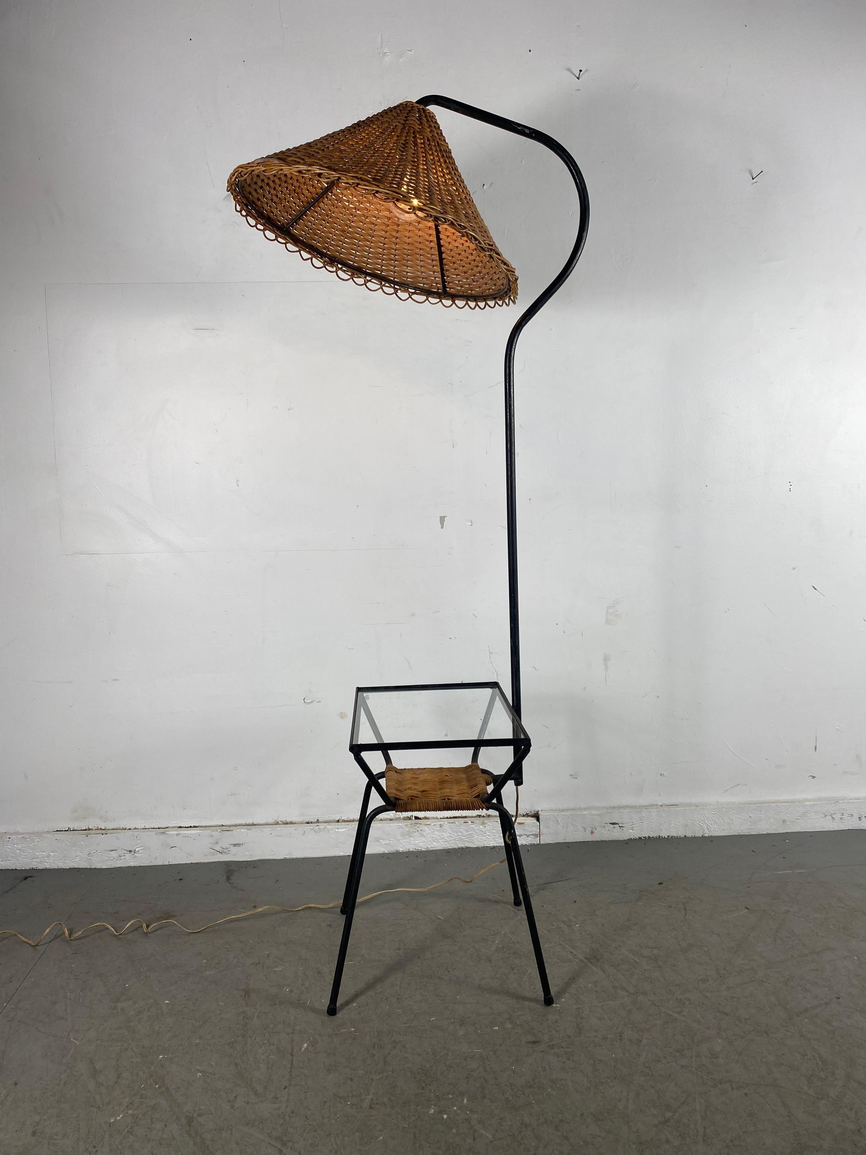 California modernist unusual wicker and iron lamp table, Classic Mid-Century Modern design, attributed to Adrian Pearsall, retains original (fixed) wicker lamp shade as well as original weaved wicker shelf, table with glass top. wicker shade