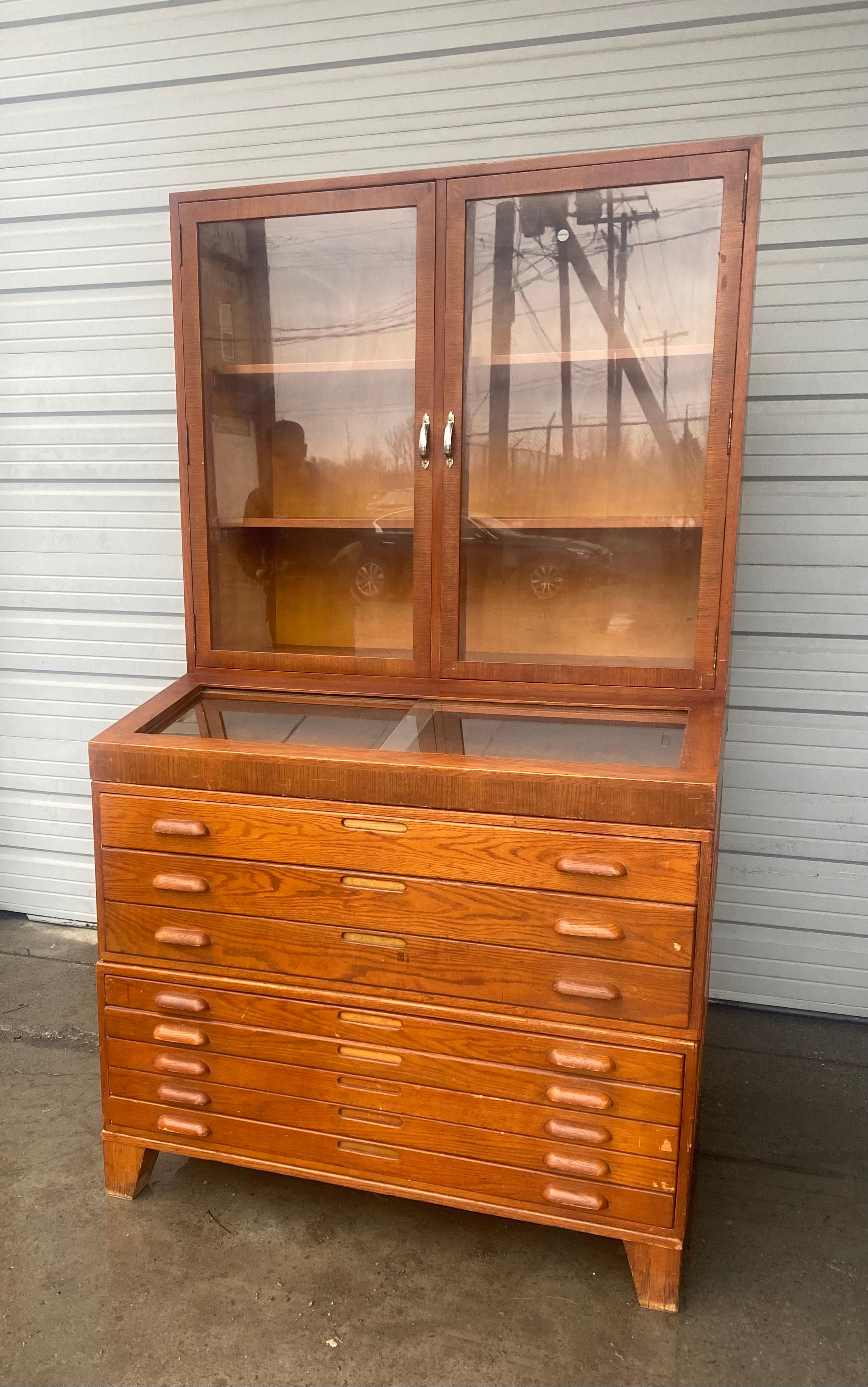 Unusual Modular ,Stacking 1940s Hamiton Blueprint / map display cabinet .3 section stacking .Sliding glass display with glass cabinet doors, large multi-drawer flat file base.  hAND DELIVERY avail to New York City or anywhere en route from Buffalo NY