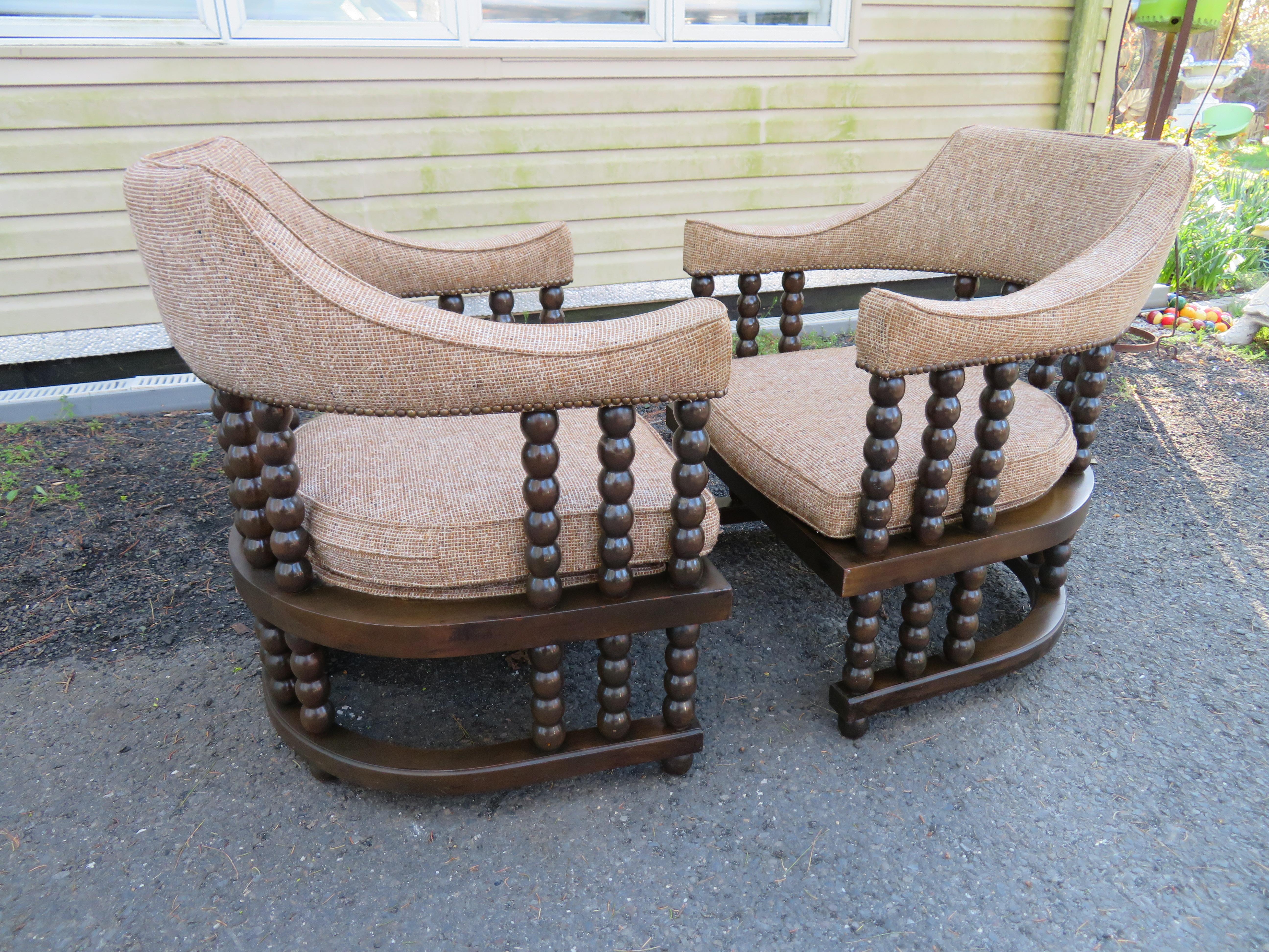 Unusual pair barrel back spool/ bobbin chairs from the mid-century. The Spool chair with its timeless classic features provides the perfect framework to showcase traditional or modern upholstery choices. Its exposed back frame offers a look as