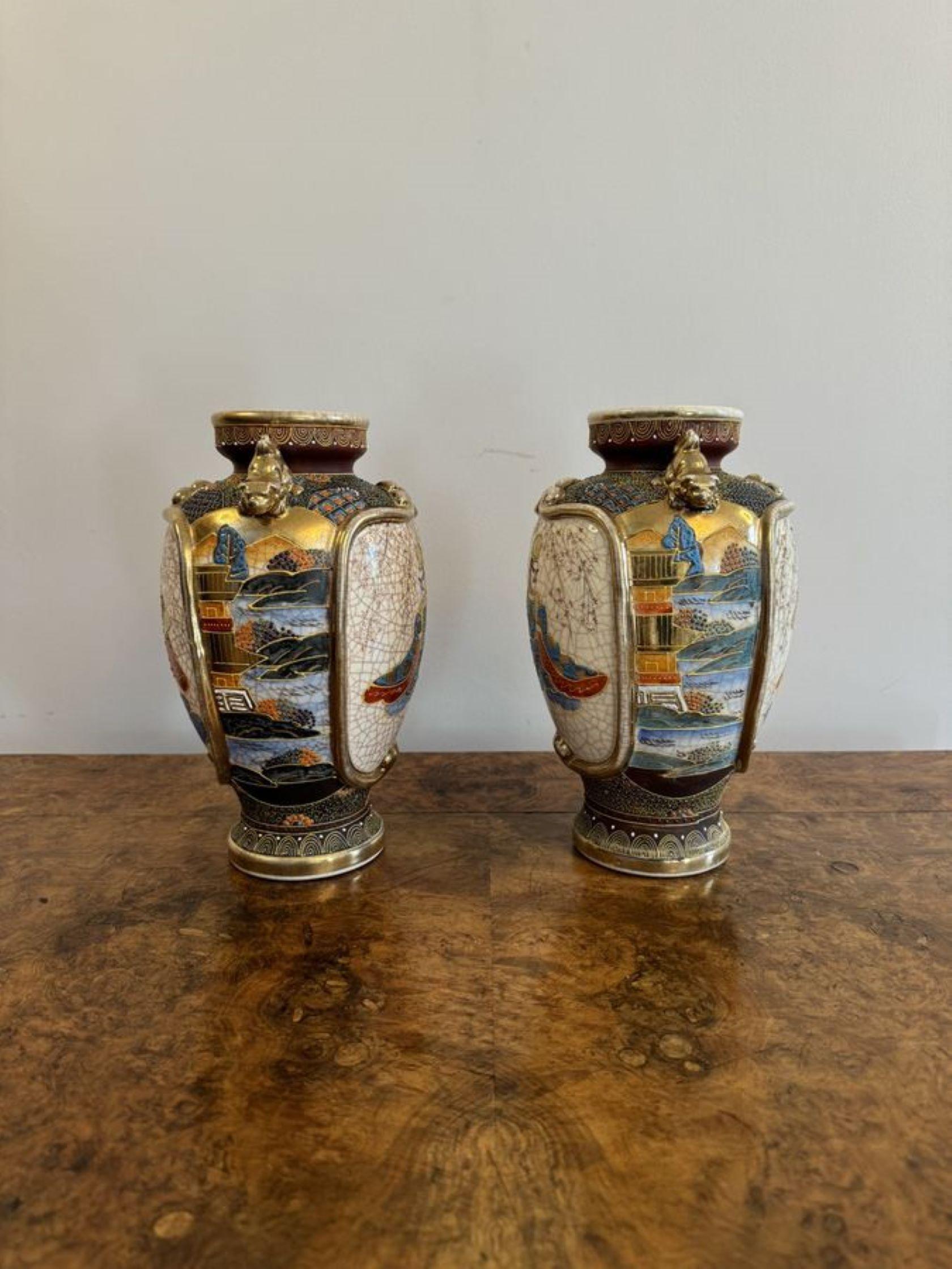 Unusual pair of antique 19th century quality Japanese satsuma vases, having unusual hand painted panels in wonderful blue, red, brown and gold colours, with dog of fo handles to the sides, raised on circular shaped bases.

D. 1880