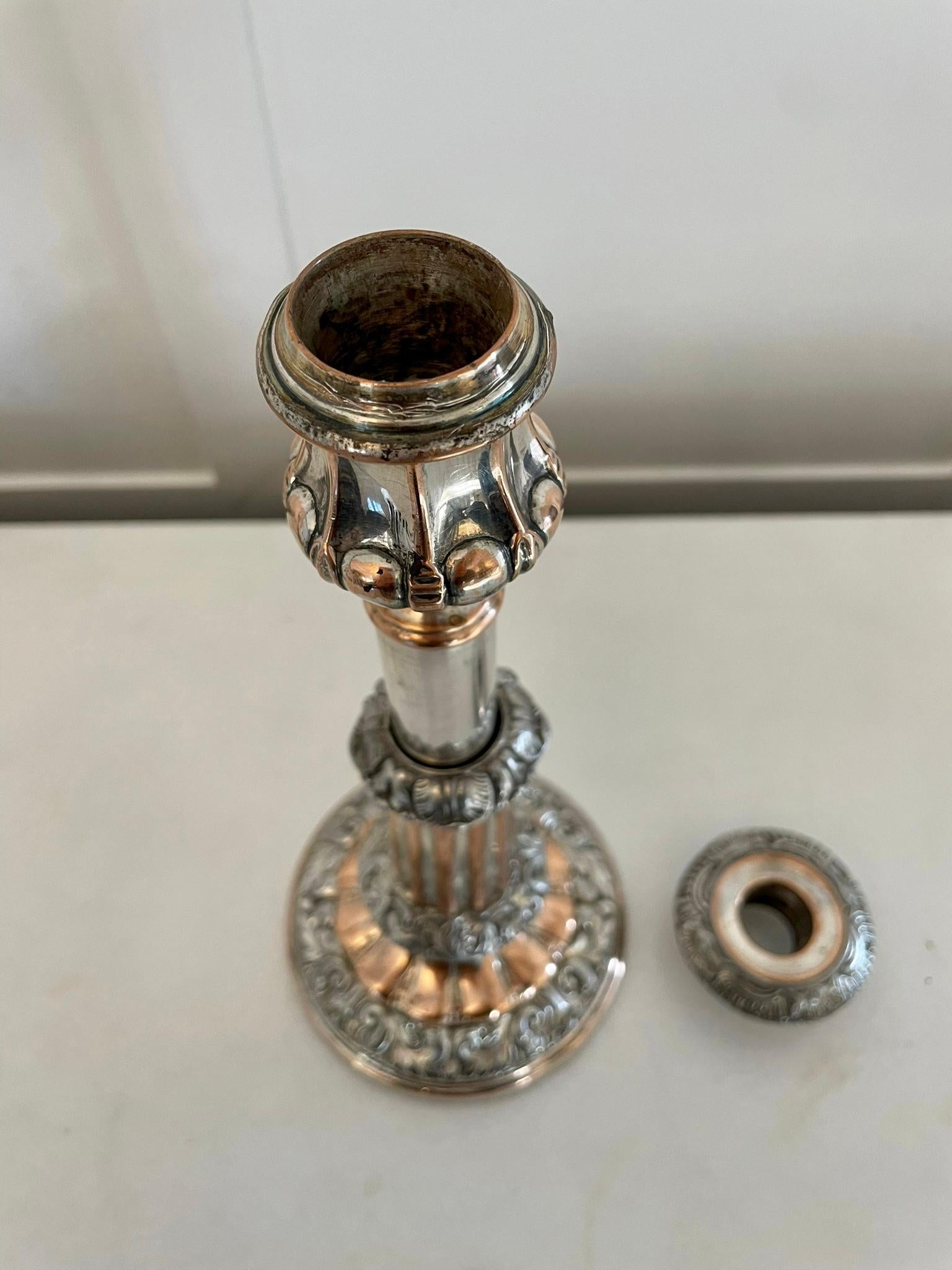 Unusual pair of antique George III quality Sheffield plated telescopic candlesticks having a quality pair of antique George III Sheffield plated telescopic candlesticks with ornate decoration 

A quaint decorative pair beautifully designed and