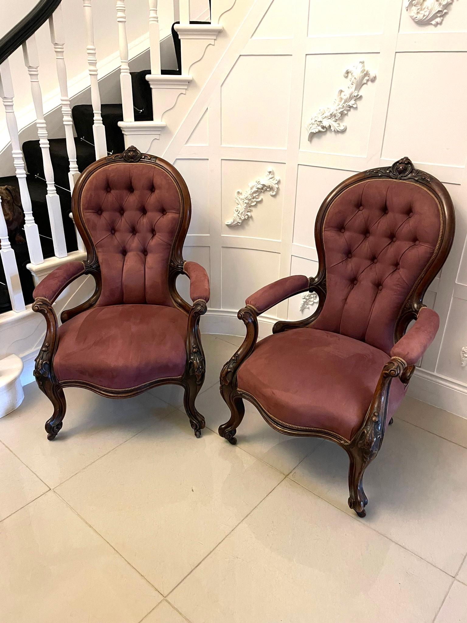 Unusual pair of antique Victorian quality carved walnut armchairs having quality carved walnut spoon backs, beautifully carved walnut open arms standing on shaped carved walnut cabriole legs to the front and out swept back legs on original castors,