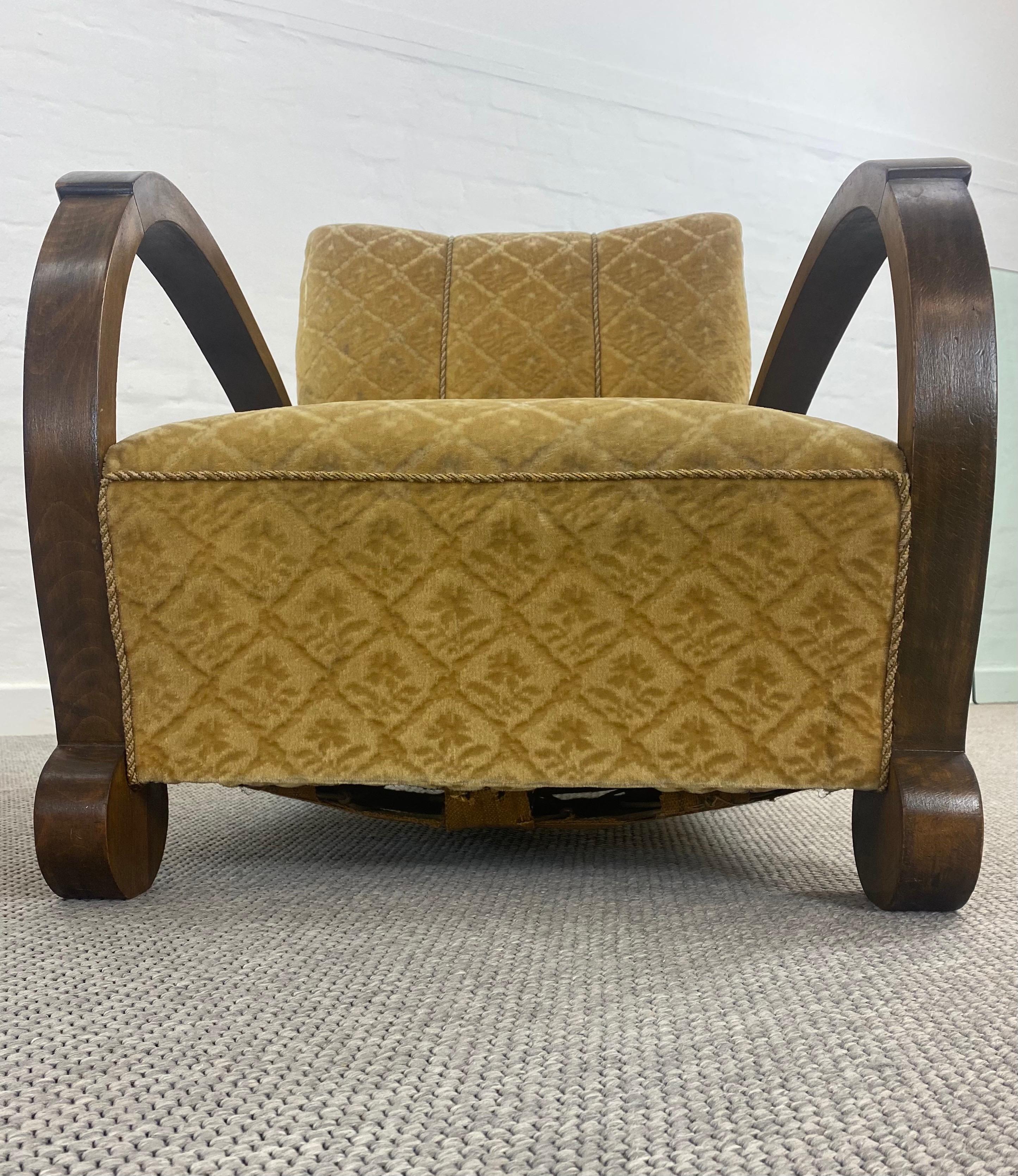A very unusual original pair of armchairs, Germany ,1920s.
With the deep sprung seats and dramatically bow armrests these chairs are very comfortable.
The round geometric foot elements are associated with the Bauhaus era.