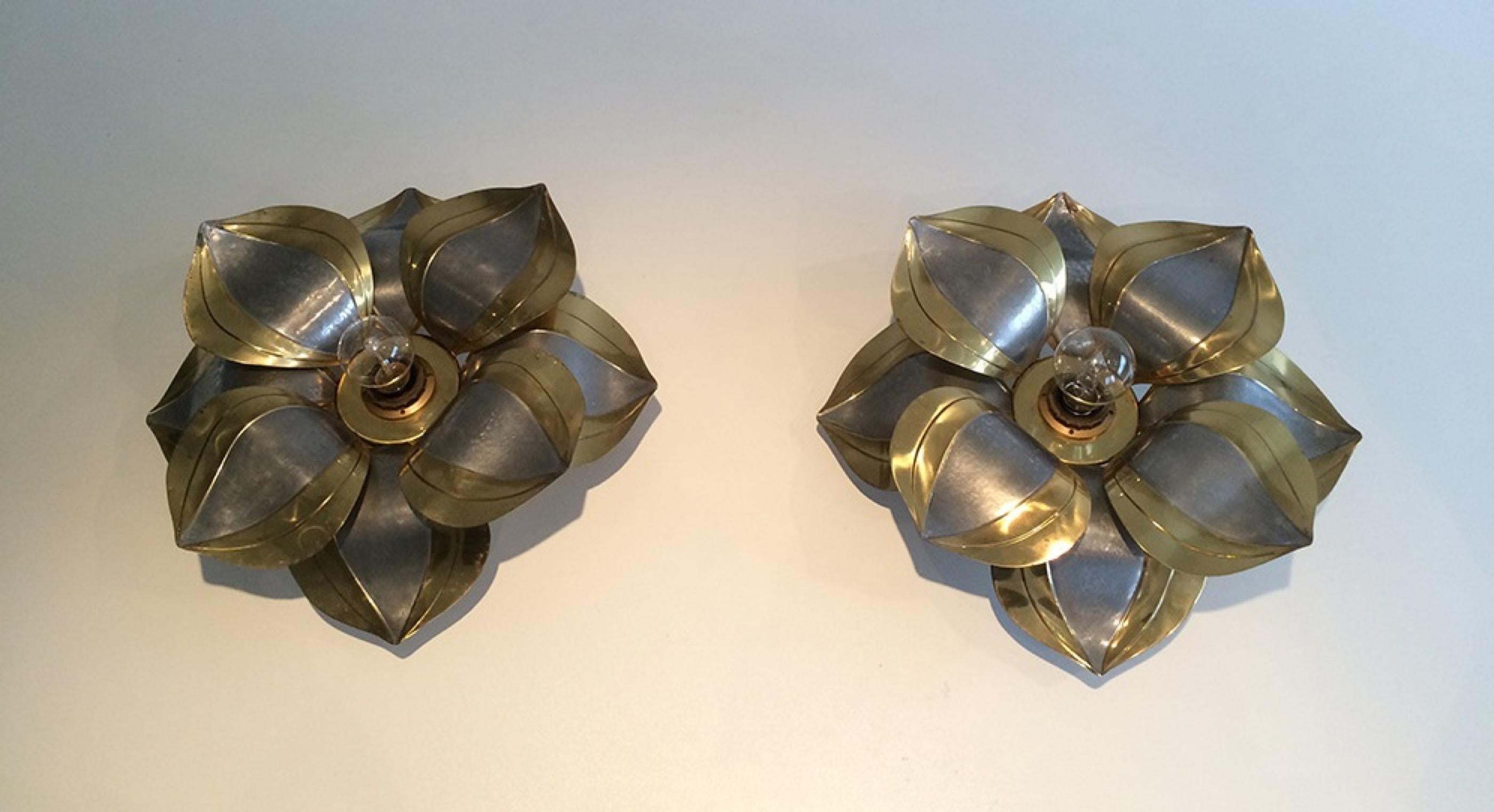 This unusual pair of wall sconces representing flowers is made of brass and brushed metal. This is French work, circa 1970.
