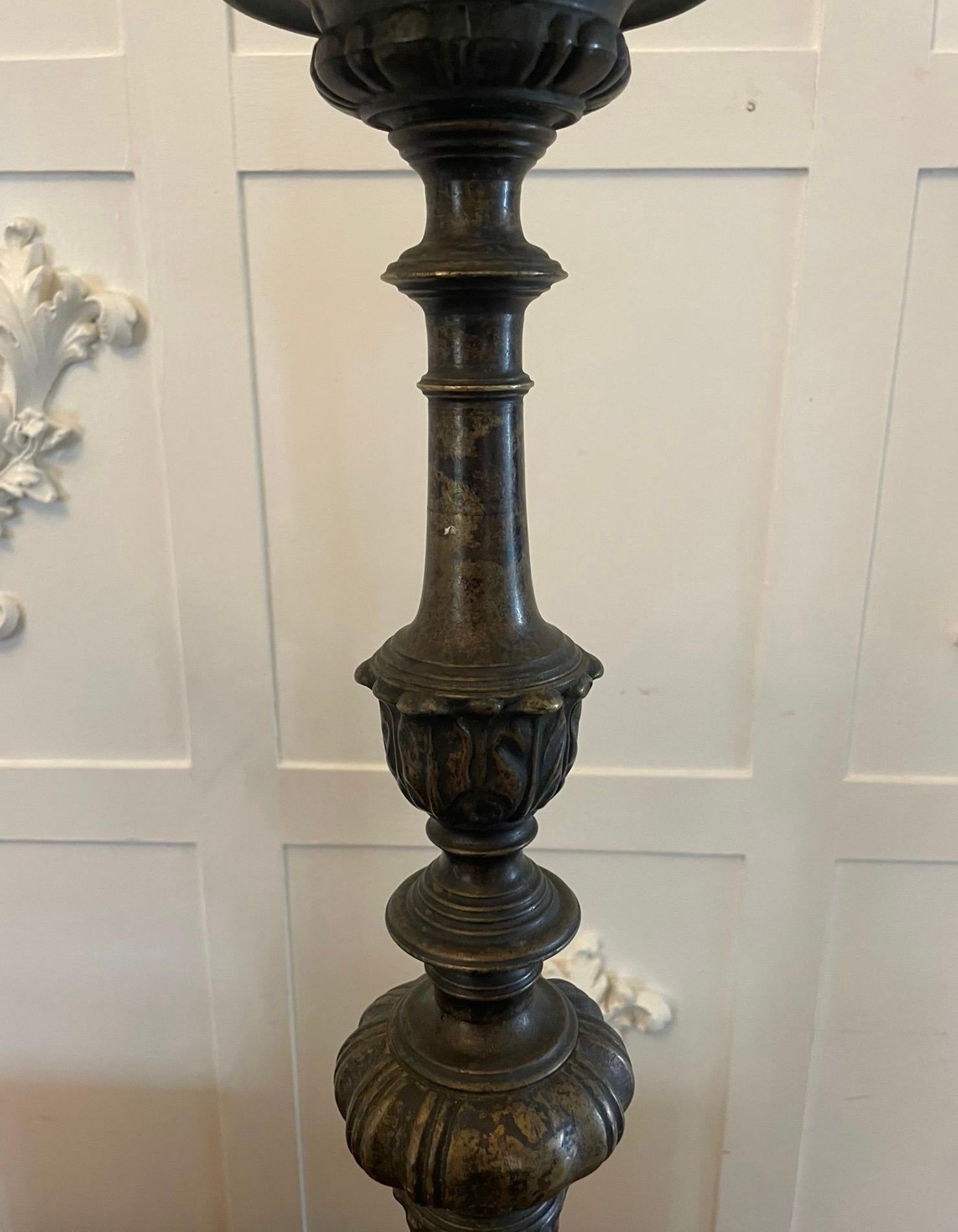Unusual pair of large antique Victorian ornate brass pricket candlesticks having a turned ornate shaped brass column standing on an ornate base depicting flowers, scrolls and paw feet


In wonderful aged condition


Dimensions:
Height 65 cm (25.59