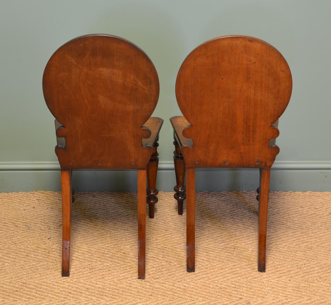 Unusual Pair Of Moulded Back Antique Mahogany Hall Chairs

Full of beautiful country charm and character and dating from around 1860, this unusual pair of antique hall chairs would compliment most homes beautifully. Each has a circular moulded