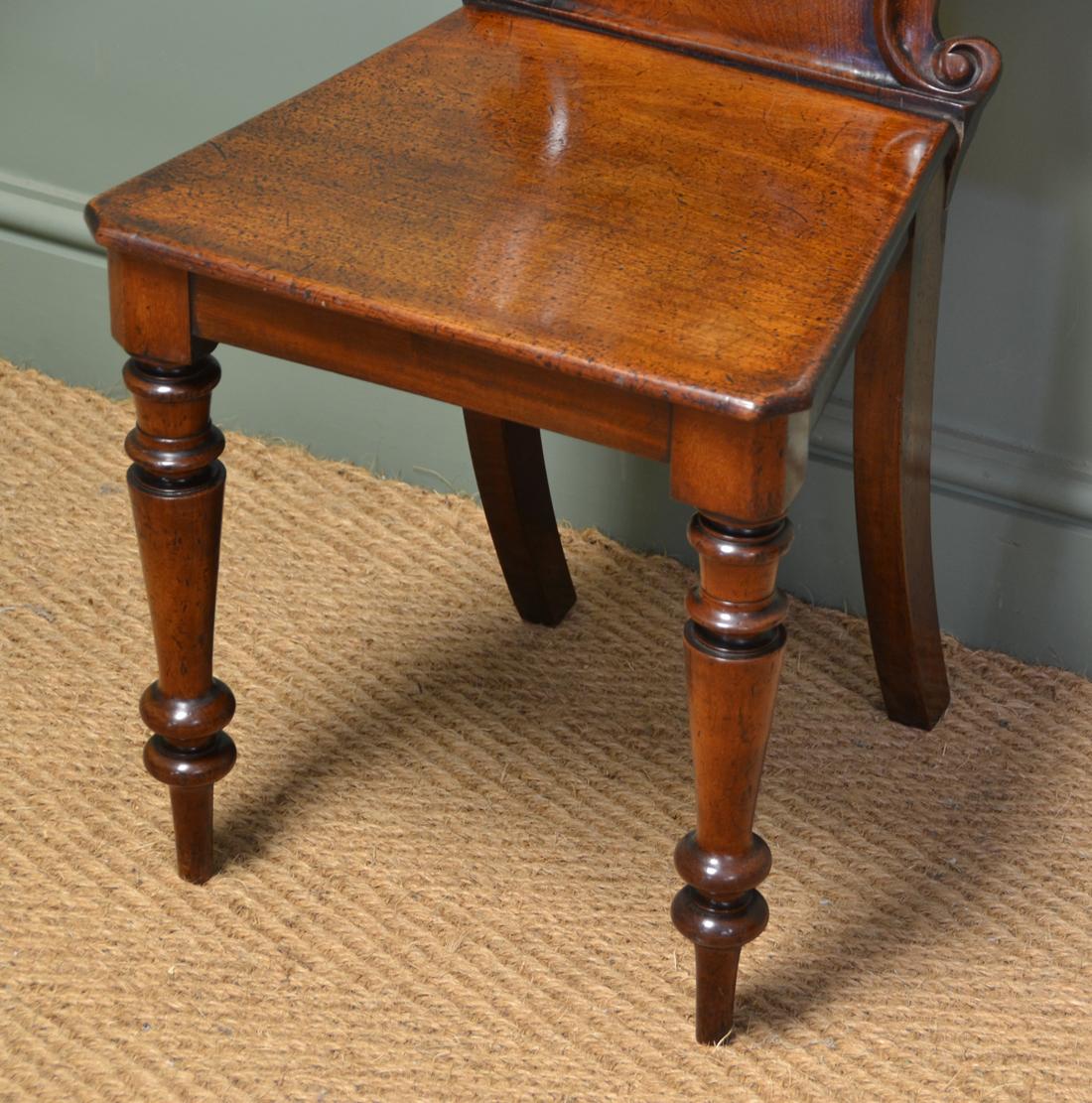 Mid-19th Century Unusual Pair Of Moulded Back Antique Mahogany Hall Chairs For Sale