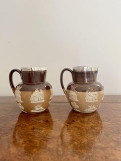 Unusual pair of quality antique Doulton Lambeth harvest jugs with silver rims