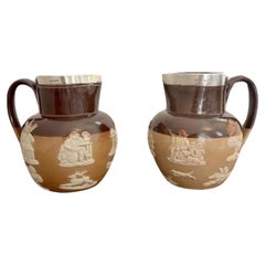 Unusual pair of quality Antique Doulton Lambeth harvest jugs with silver rims 