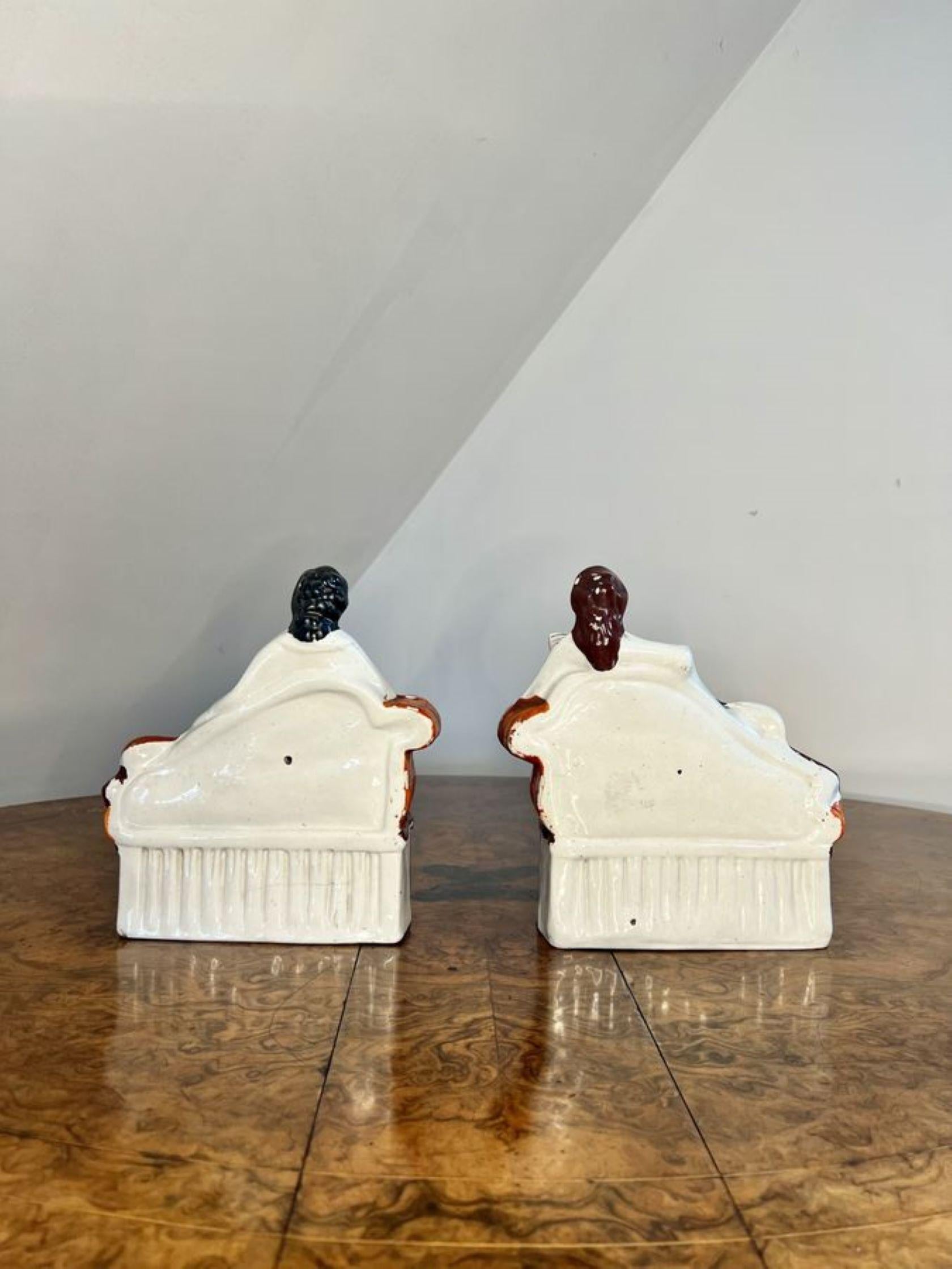 Unusual pair of quality antique Victorian Staffordshire bookends having an unusual quality pair of antique Victorian bookends of a girl and boy laying on a chaise longue with a musical instrument reading a book fantastic hand painted decoration in