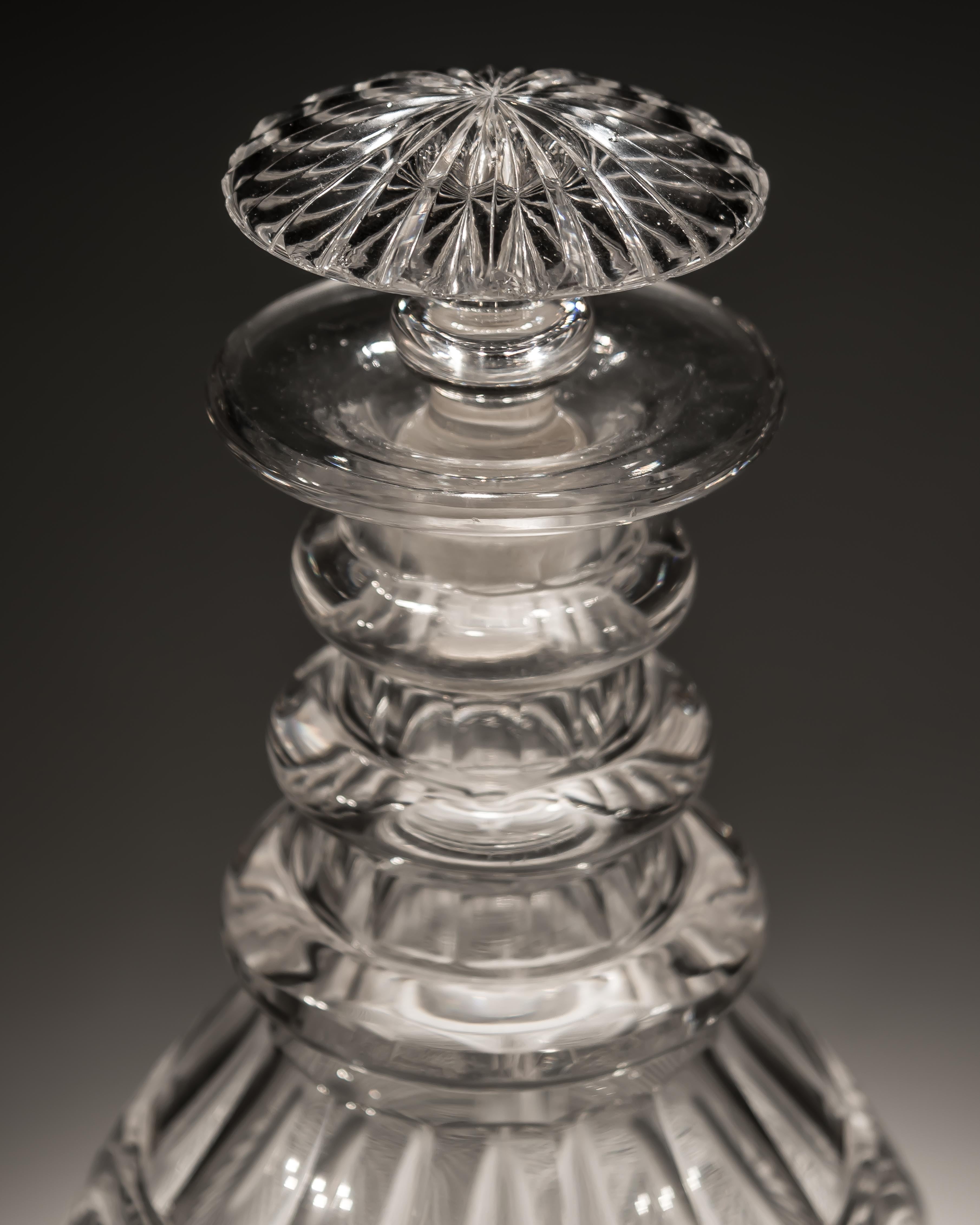 An rare pair of decanters cut with sunburst panels.