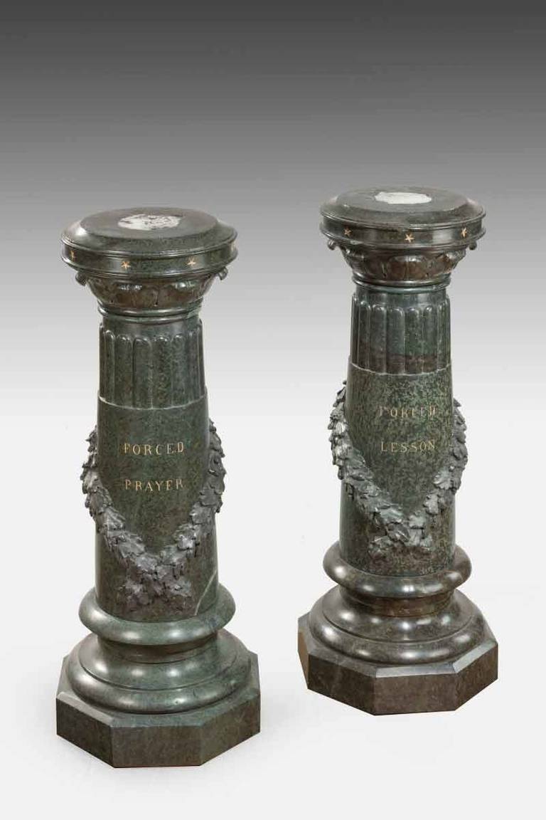 An unusual pair of Victorian marble revolving topped pedestals. One marked ‘Forced Lesson’, one marked ‘Forced Prayer’.

These beautiful pedestals were clearly designed to hold sculptures with the titles of the works inscribed on the stems. The fact