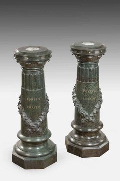 A pair of Victorian marble revolving topped pedestals