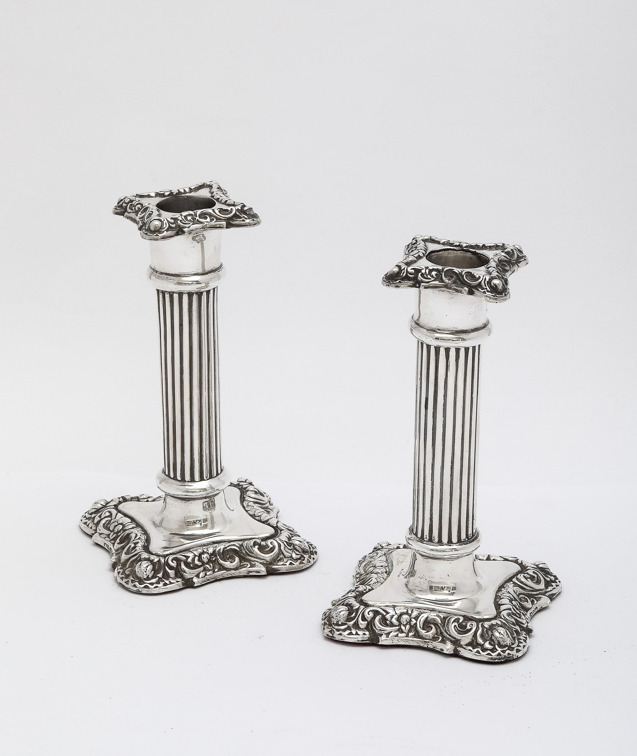 Unusual pair of Victorian Period, sterling silver, column-form candlesticks, Birmingham, England, year-hallmarked for 1895, William Davenport - maker. Each candlestick measures 5 inches high x approximately 2 3/4 inches wide (at widest point) x