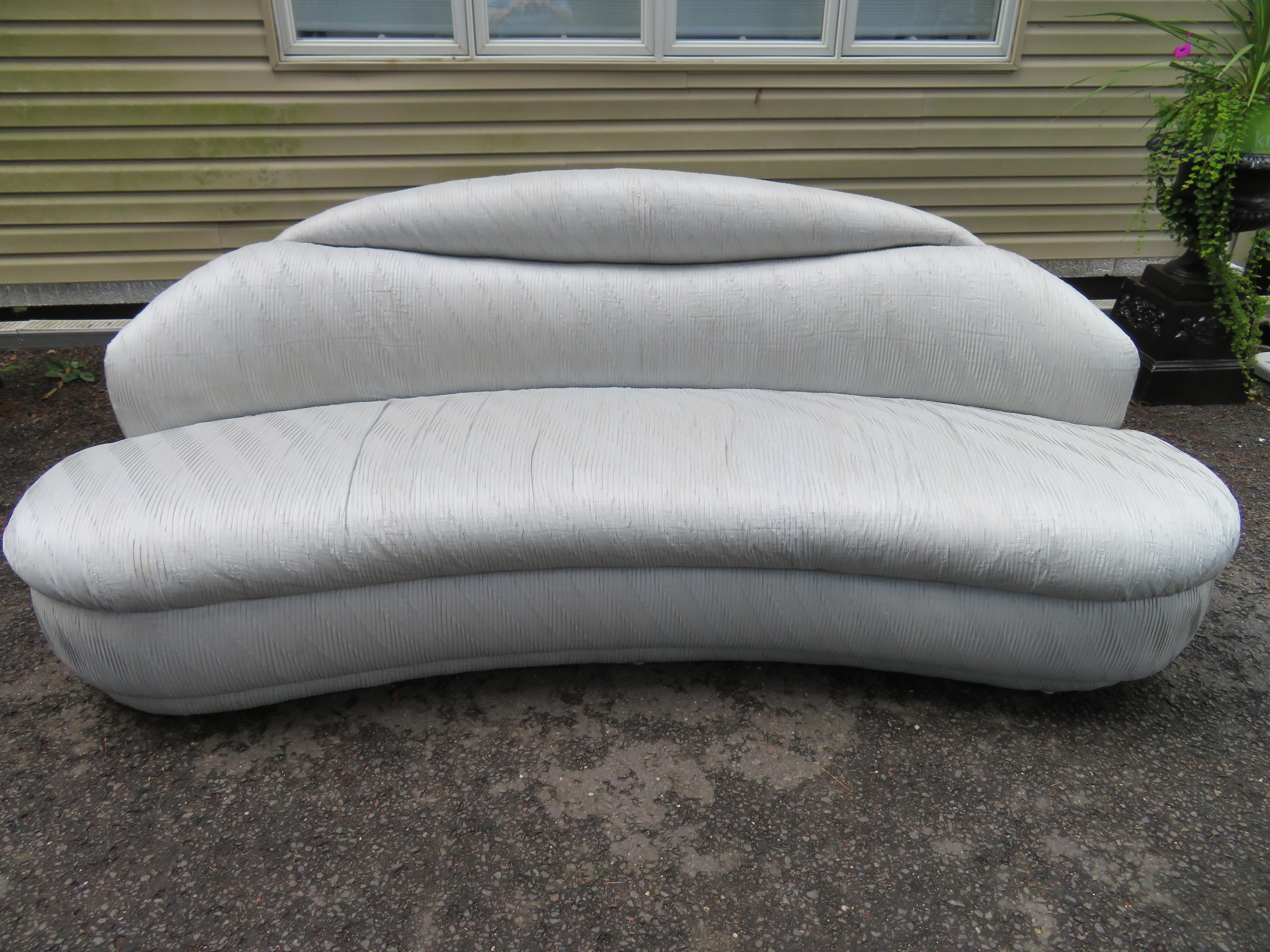 Unusual pair of Weiman kidney shaped curved sofas-Vladimir Kagan style. We especially love the original ruched fabric in a soft grey-very KWID indeed! The fabric does have a bit of wear so new upholstery is recommended but we would redo the ruched
