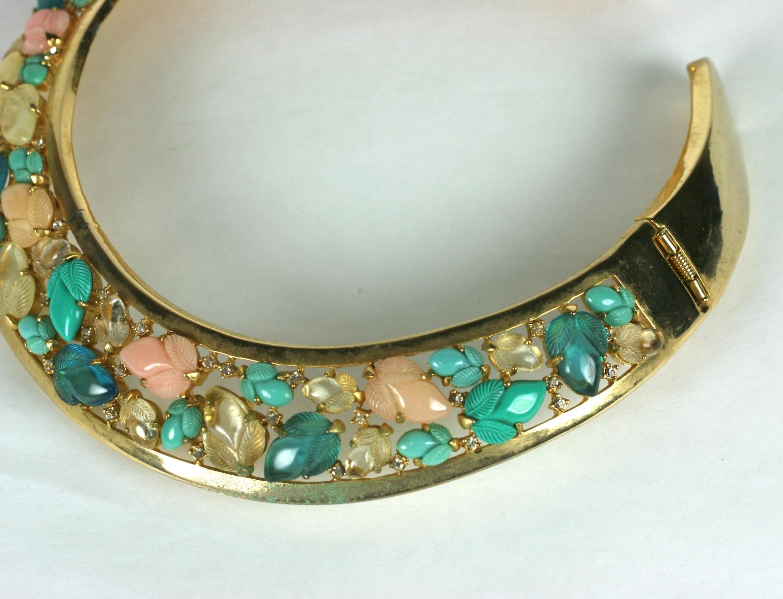 Unusual Pastel Fruit Salad rigid collar incorporating Trifari fruit salad cabochons from the 1980's. This design was made by Lanvin but there are no markings. A pair of hinges on back allows entry. 
Crystal carved stones in moonstone, turquoise,