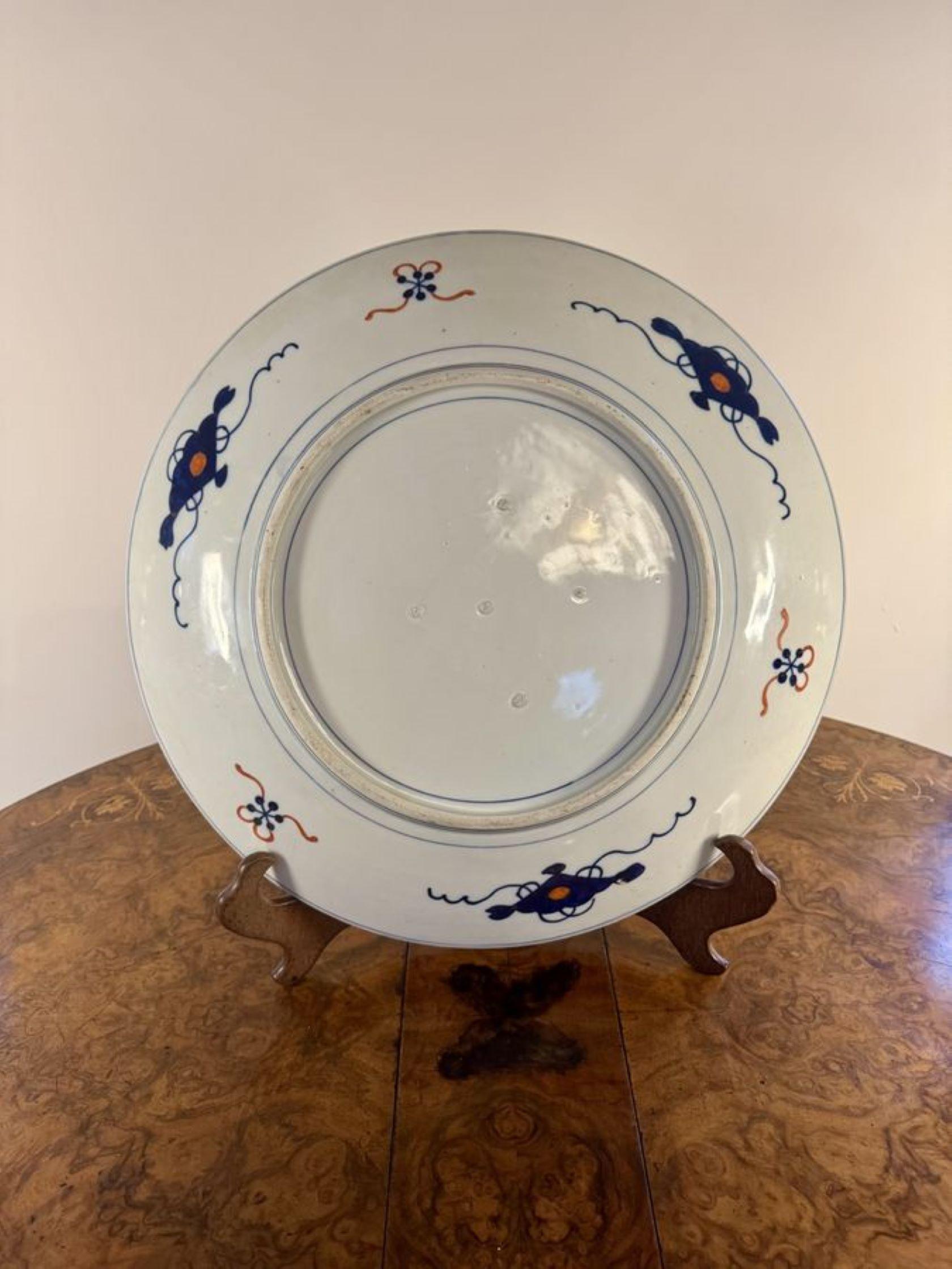 Unusual quality antique Japanese imari charger, having an unusual antique Japanese imari charger decorated with a basket of flowers to the centre surrounded by highly decorated panels with scrolls and patterns in fantastic hand painted green,