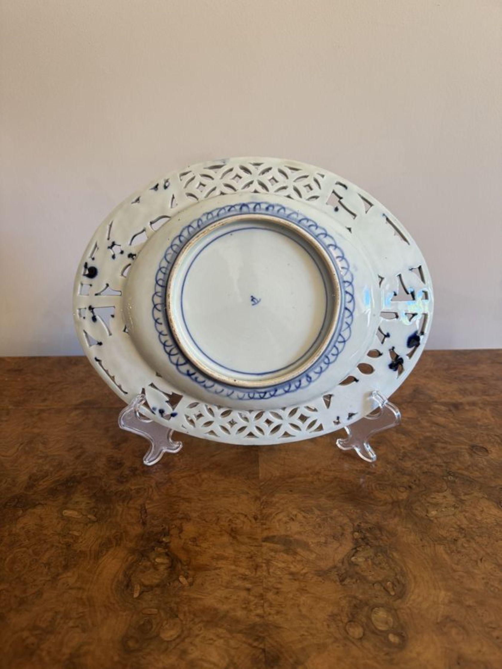 Unusual quality antique Japanese imari oval plate, having an unusual quality antique Japanese imari plate with a pierced border, decorated with flowers, leaves, a bird hand painted in fantastic red, blue, gold and white colours. 

D. 1900 