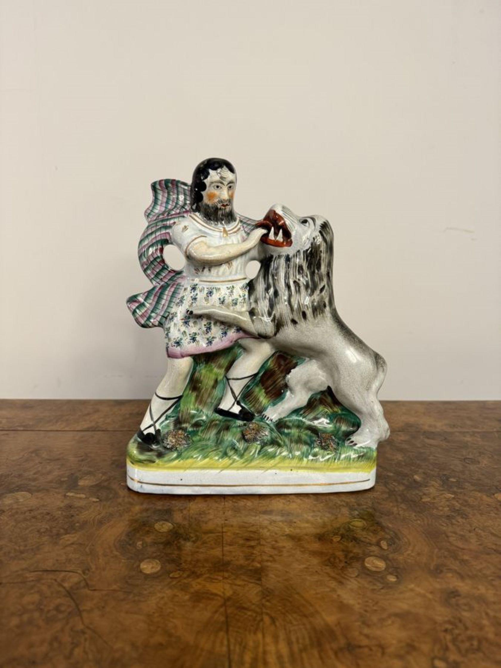 Unusual quality antique Victorian 19th century Staffordshire figure of Samson and the lion, having a quality Staffordshire figure hand painted in stunning green, black, red, white, brown and gold colours, standing on an oval shaped gilded