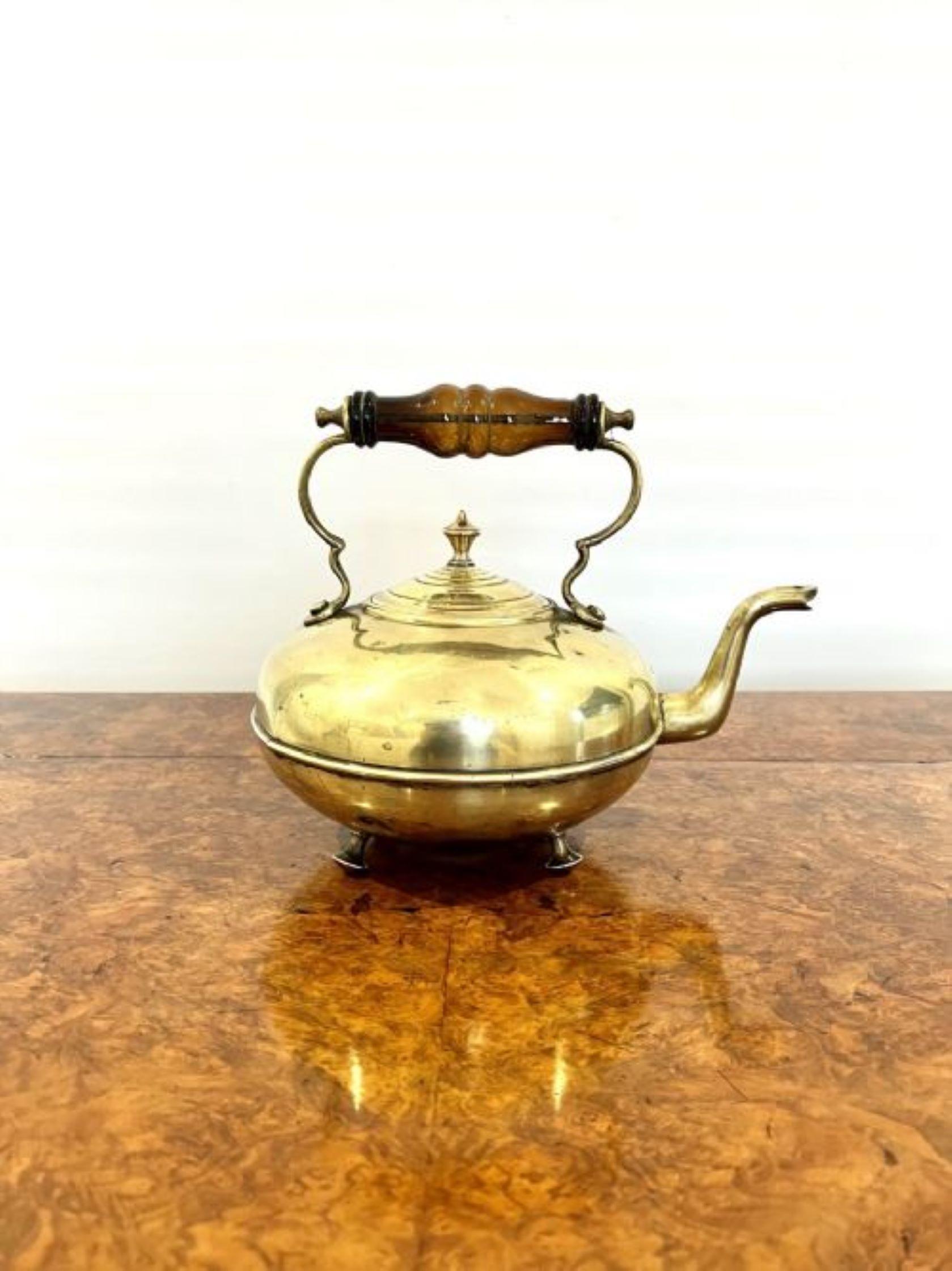 Unusual quality round antique Victorian quality kettle having a quality turned brown glass handle, shaped lift off lid standing on ball feet. 
