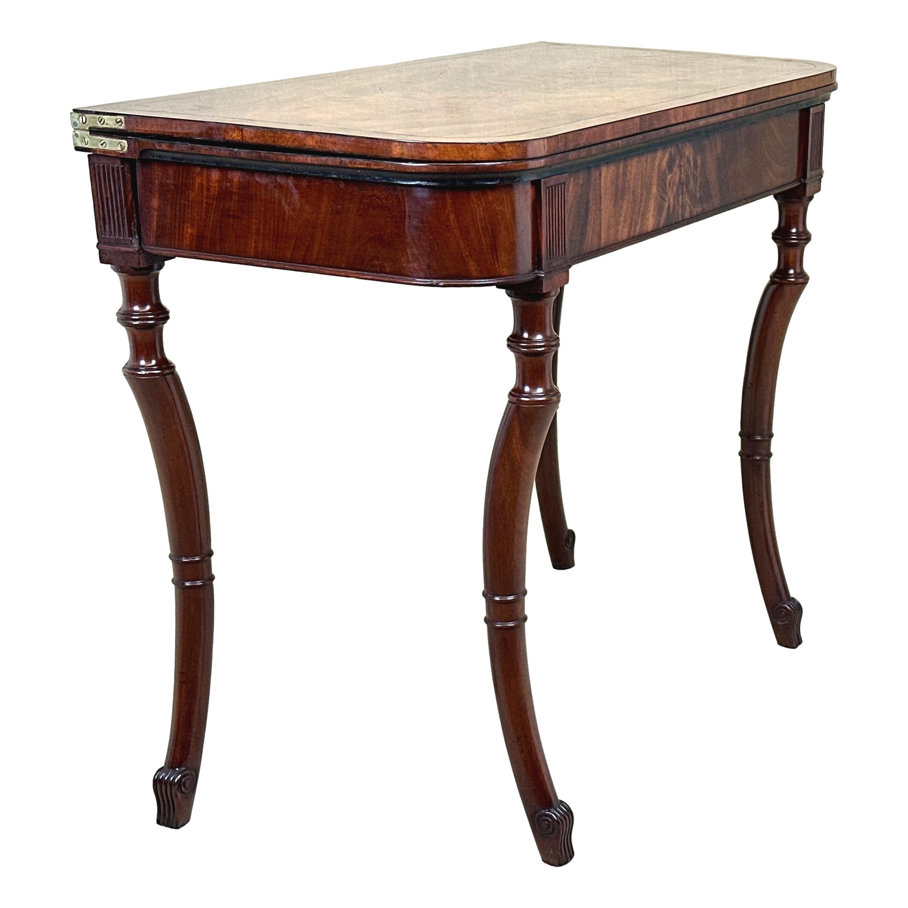 A Very Good Quality 19th Century, Regency Period Mahogany Tea Table, Having Superbly Figured Foldover Top With Banded Decoration And Well Figured Interior Retaining Good Surface And Patina, Above Elegantly Figured Frieze With Matchstick Fluted
