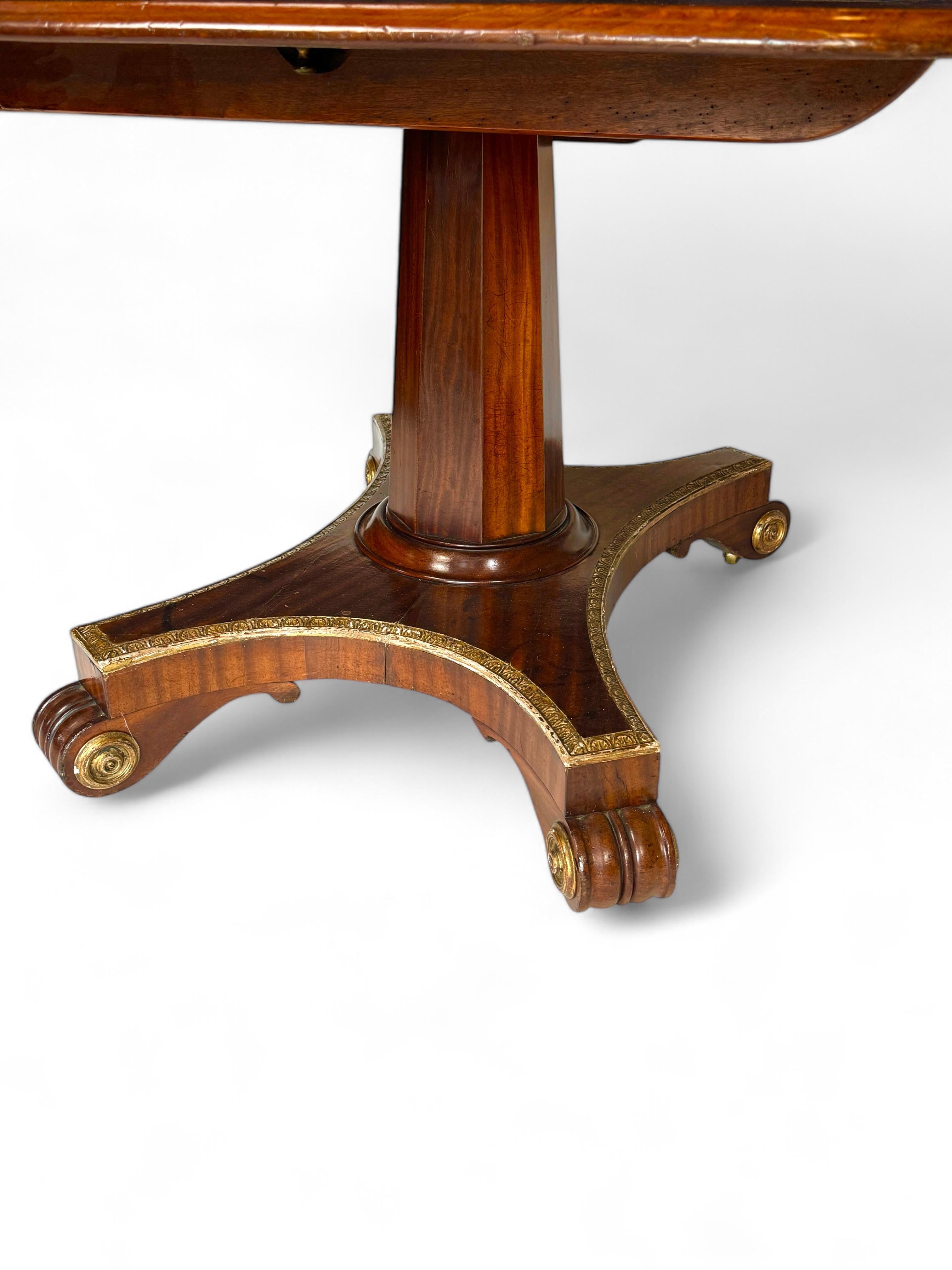 Unusual Regency twin pedestal mahogany and parcel gilt dining table 1