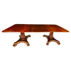 Unusual Regency twin pedestal mahogany and parcel gilt dining table
