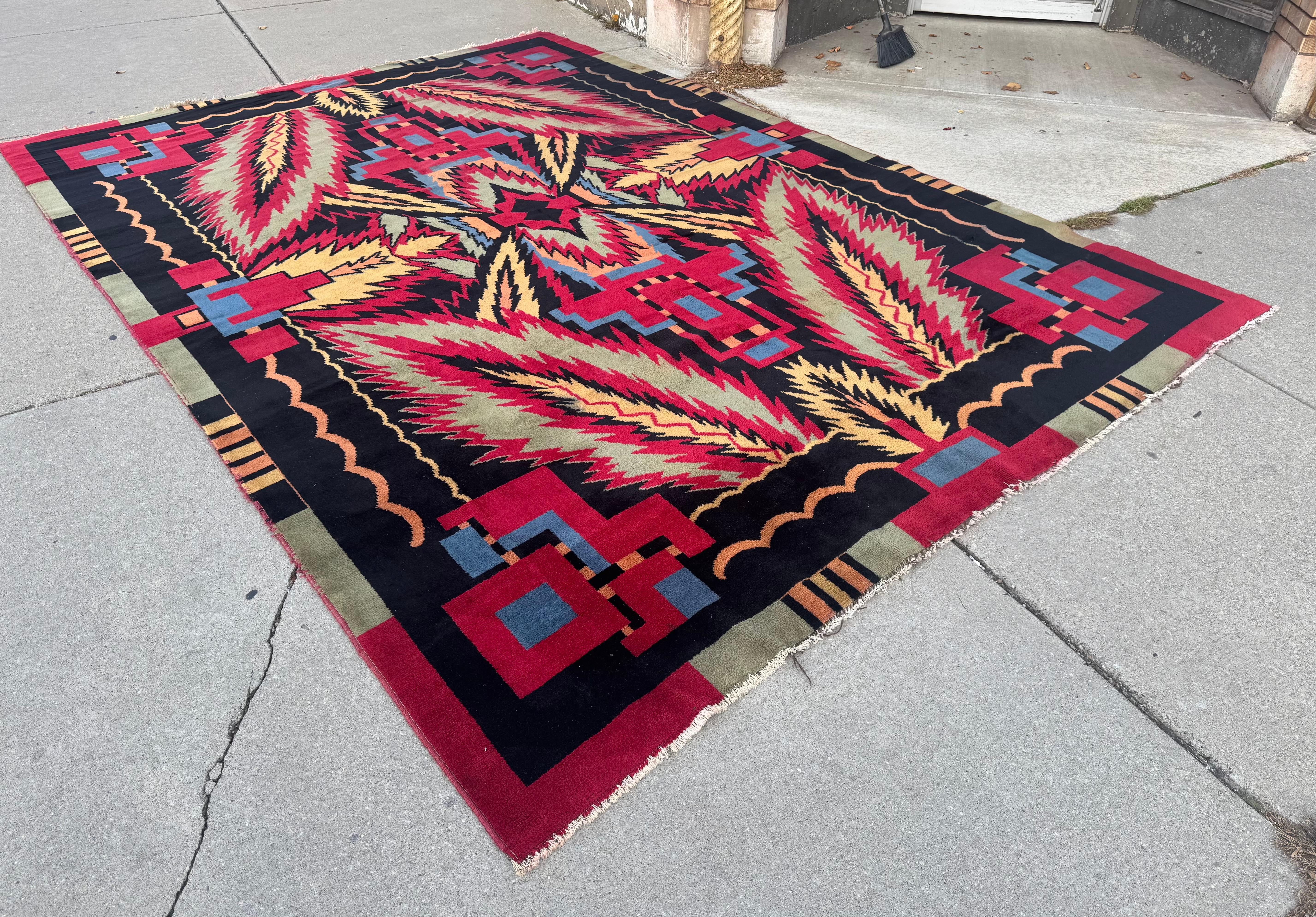 Most Unusual Room Size  1930's Indian Art Deco Rug. measuring  9' x 13 ....Amazing design,, Feathers ,aztec  , geometric designs,,, bold colors,, dynamic visuals,, very minor bleeding,, some wear,, staining  (see photos) Have not tried to clean. 
