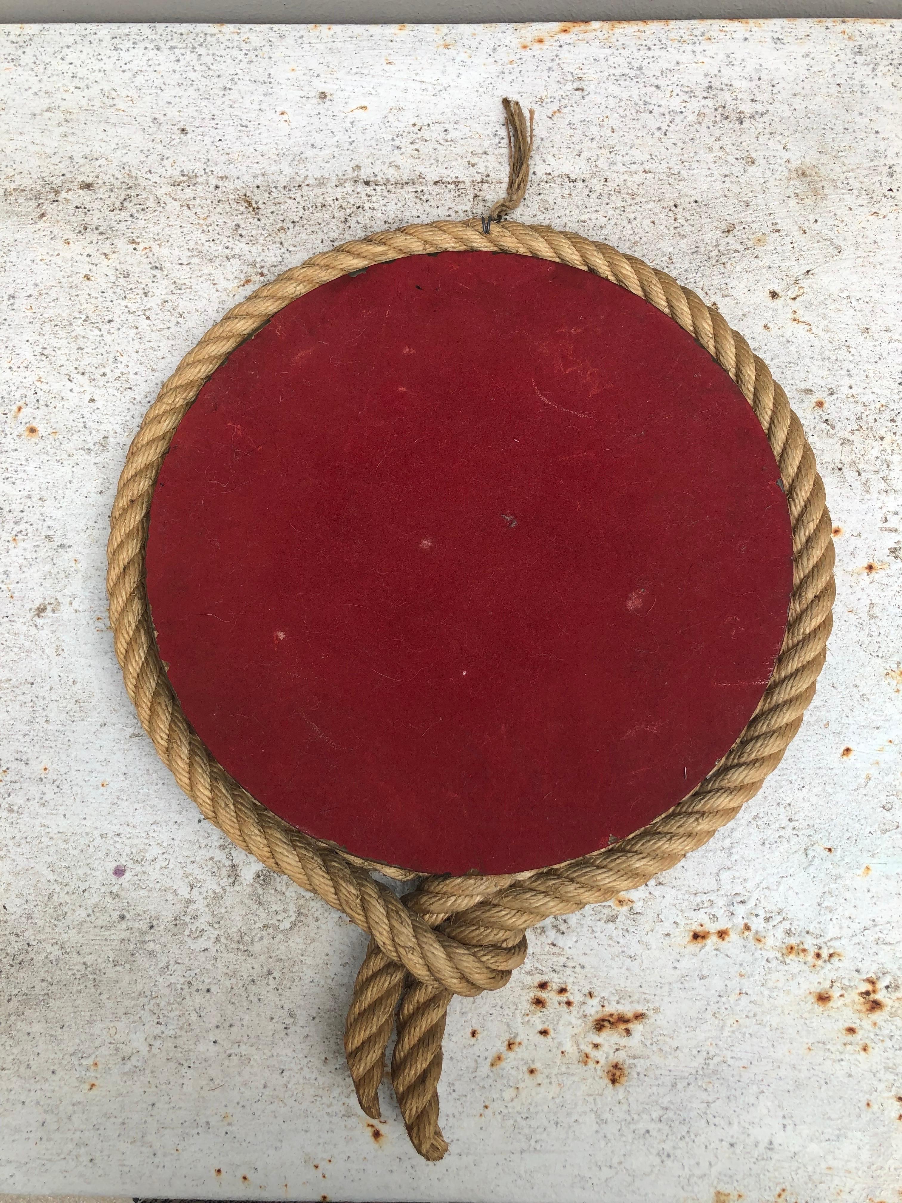 Unusual French round rope mirror Audoux Minet, circa 1960.
Lariat shape.
Measures: Width / 13.5 inches.
Height / 17.5 inches.