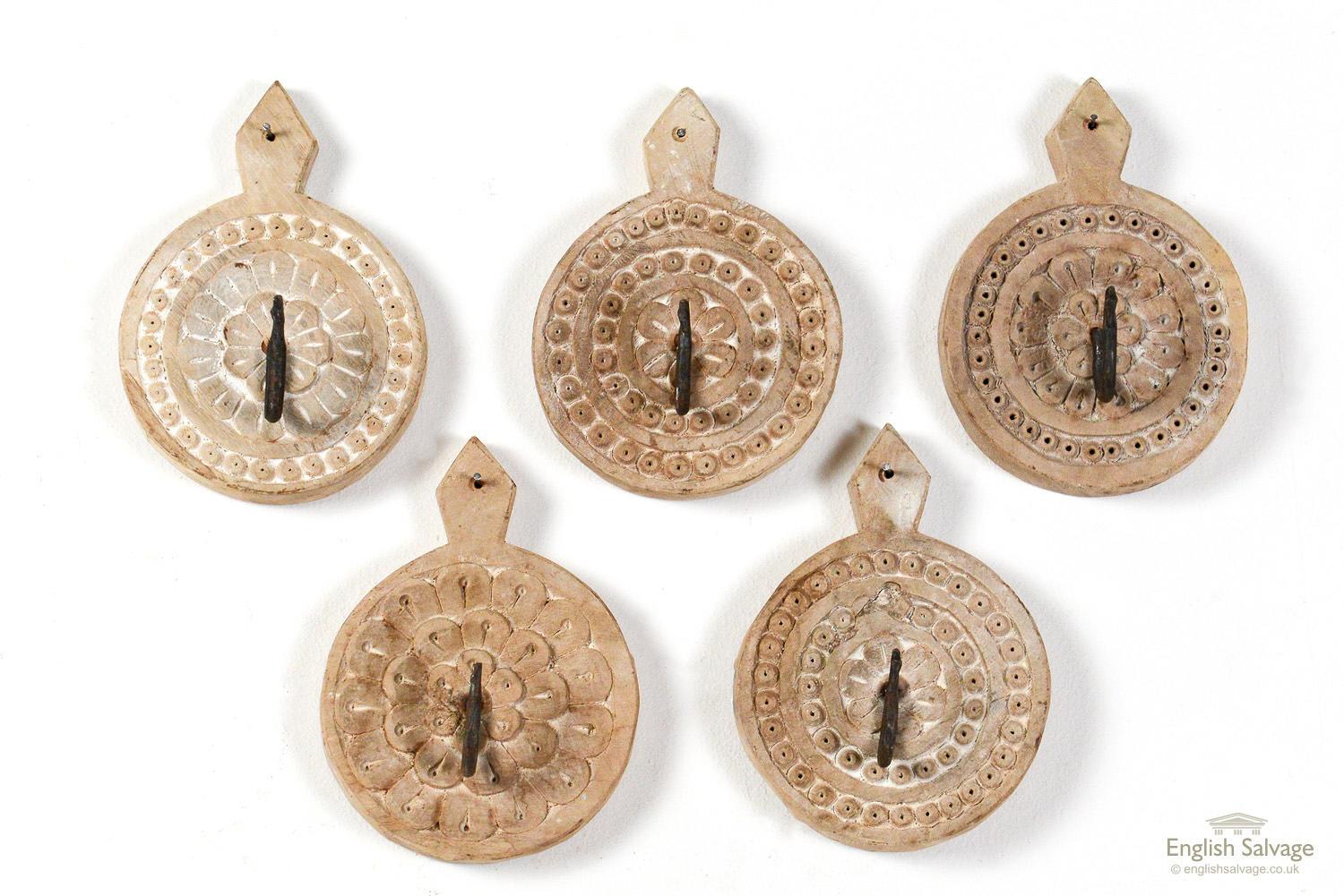 Reclaimed single wall hooks with charming hand carved circular wooden wall fixings. Approximate size of each stated below (depth doesn't include the hook). Six are carved from a dark colored wood, the others are made from a lighter wood, as shown in
