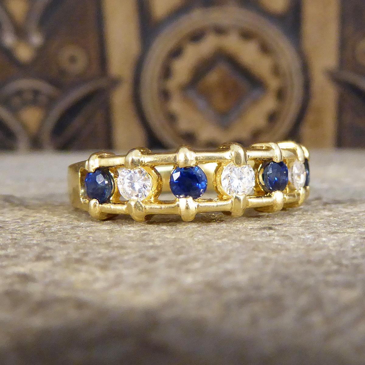 An usual and beautiful ring design consisting of 7 alternating Sapphires and Diamonds in a ladder like design with spaces between the stones. The ring holds three Diamonds totalling 0.21ct and four bright and vibrant Sapphires totalling 0.32ct. A