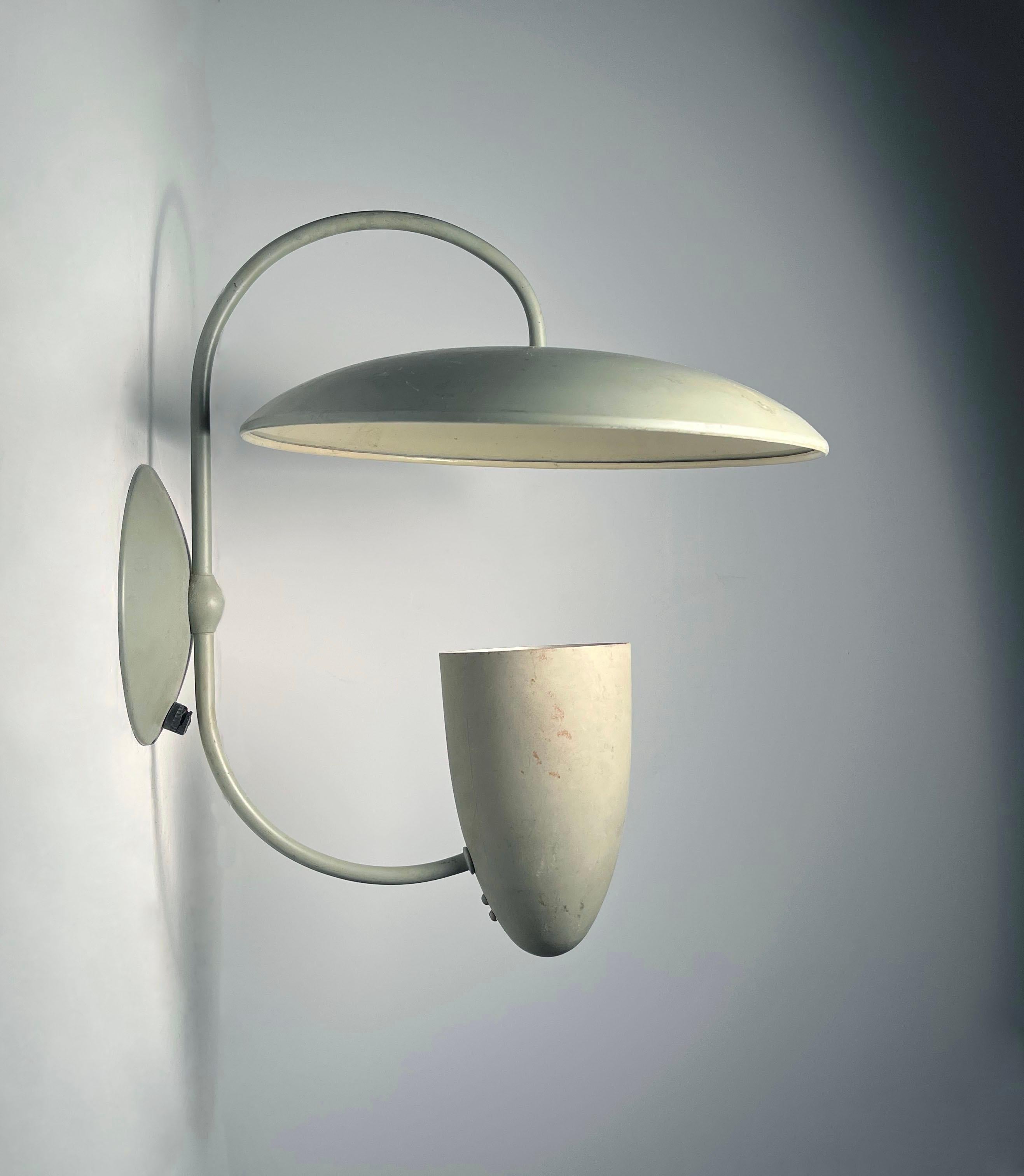 Unusual Scarce Vintage Reflector Sconce Attributed to Kurt Versen

Have yet to identify this unusual lamp period reflector sconce. Appears to be American and very much in the manner of Kurt Versen

wear and marks to original matt gray finish.