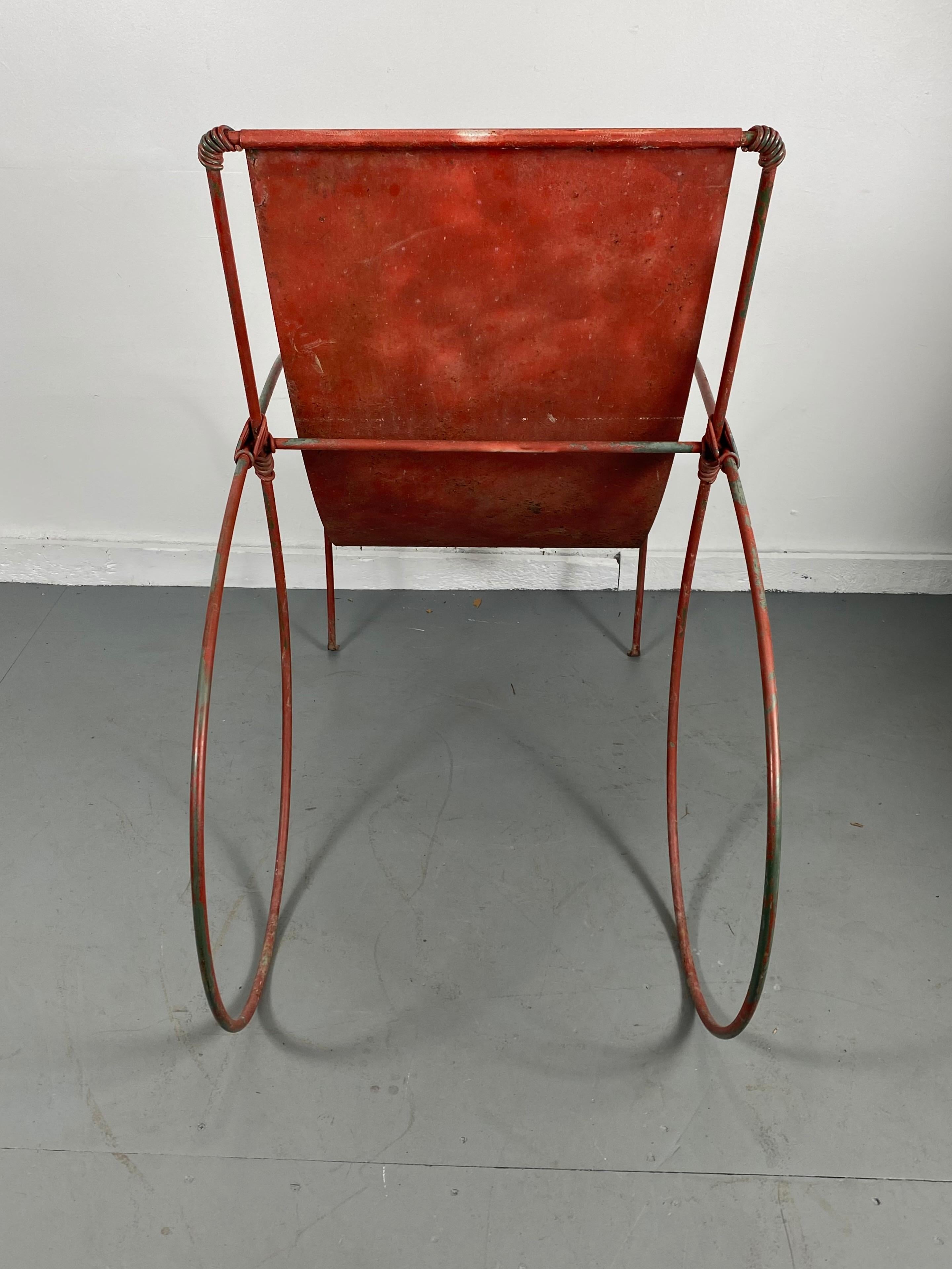 Unusual sculptural iron garden lounge chair manner of Jean-Charles Moreux, wonderful design, whimsical sculpture! welded iron frame, metal sling seat. Hand delivery avail to New York City or anywhere en route from Buffalo NY.