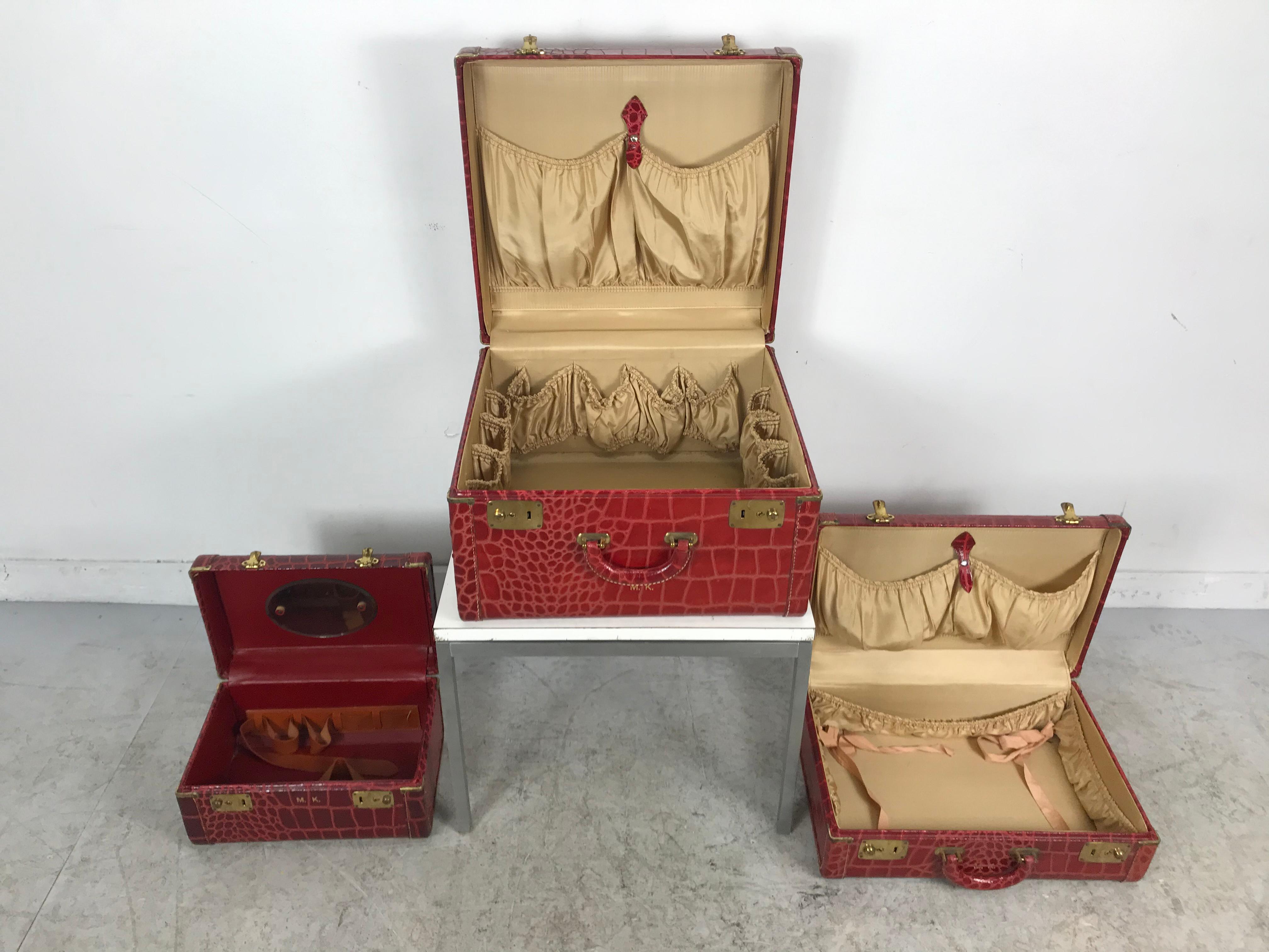 Unusual set of 3 red leather, faux alligator luggage, complete with two suitcase's, and cosmetic case. Amazing original condition, smoke fee, pet free, odor free, honestly like new. In certain this set was never used and stored in proper sealed and