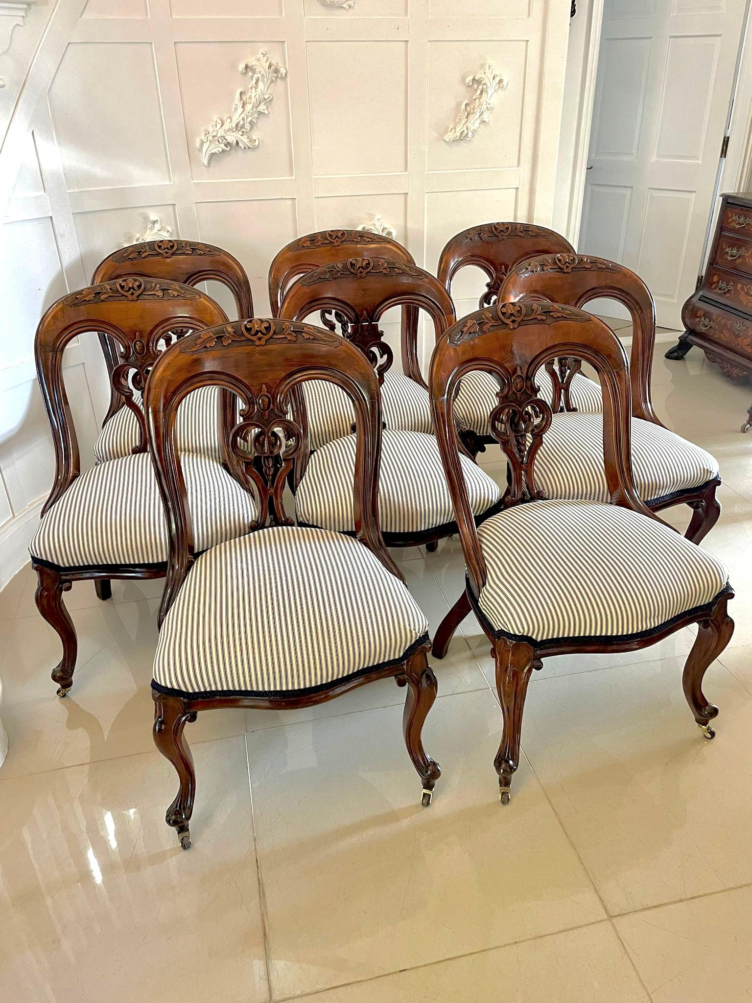 Unusual set of 8 antique Victorian quality carved mahogany library/dining chairs having a quality large mahogany shaped back with an attractive carved centre splat, newly reupholstered serpentine shaped seats in a quality fabric standing on shaped
