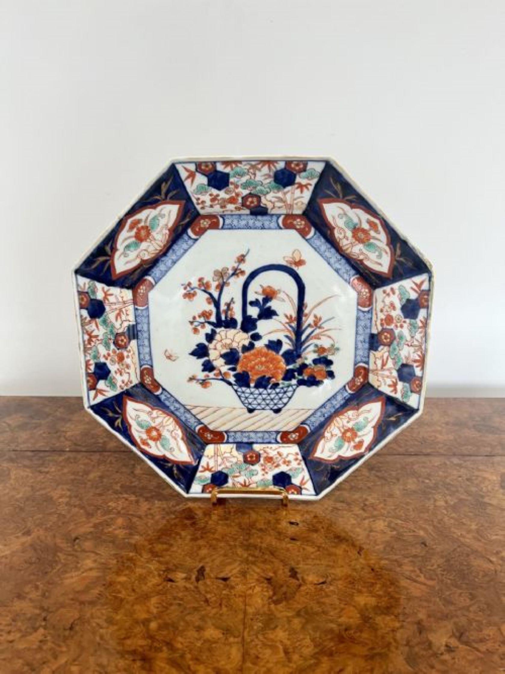 Unusual shaped antique Japanese Imari plate having an unusual shaped antique Japanese Imari plate with wonderful hand painted decoration having a basket of flowers to the centre surrounded by panels with flowers, leaves and scrolls in red, blue,