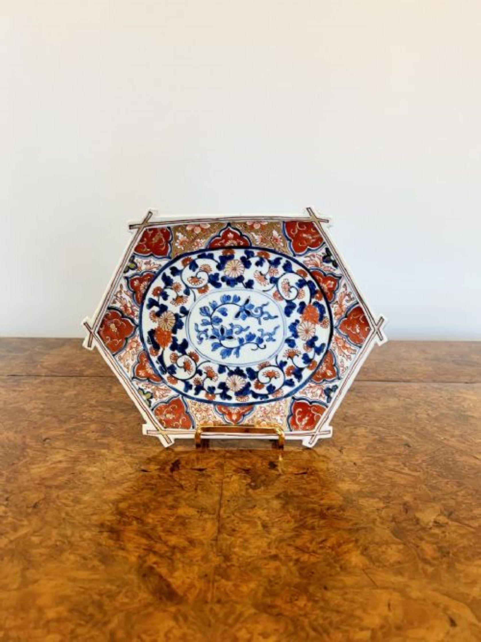 Unusual shaped antique Japanese Imari plate having an unusual shaped antique Imari Japanese plate with a shaped bamboo edge, lovely hand painted decoration with flowers, leaves and scrolls hand painted in wonderful red, blue and white colours. 