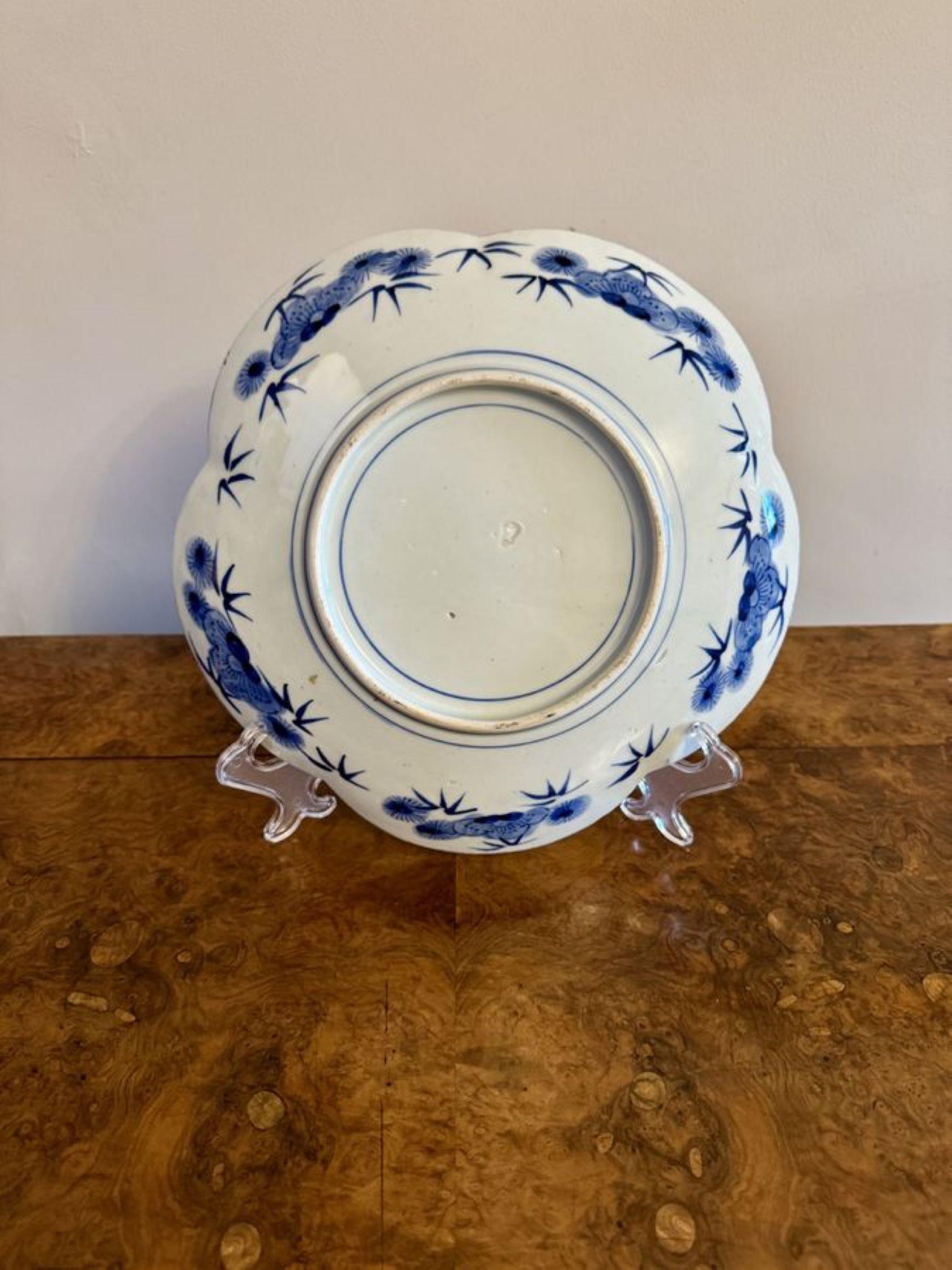 Unusual shaped antique Japanese imari plate having an unusual shaped antique Japanese imari plate, decorated with flowers and traditional patterns hand painted in fantastic red, blue, white and green colours.

D. 1900