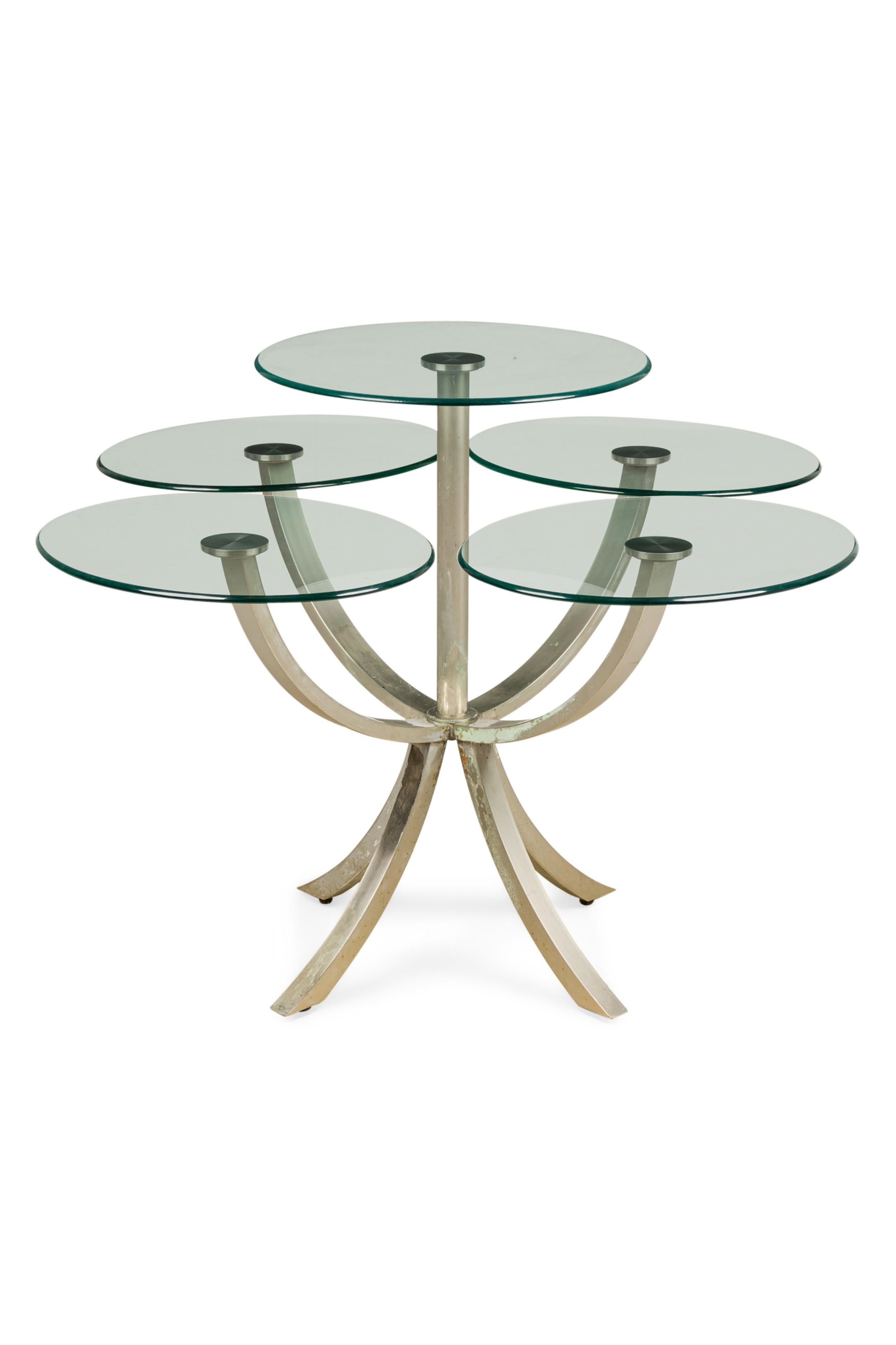 American Mid-Century silvered metal center / displaly table designed with 4 round glass shelves and a centered tall shelf resting on 4 splade legs (each glass shelf is 24